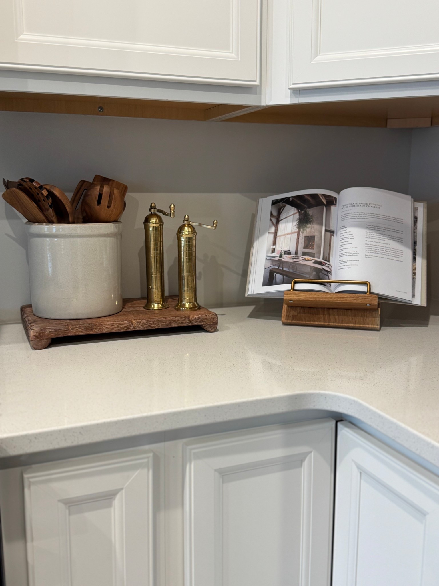 Kitchen decor; wood riser, brass salt and pepper grinders, kitchen croc, beige crock, wood utensils, cookbook holder 

#LTKSaleAlert #LTKSeasonal #LTKHome