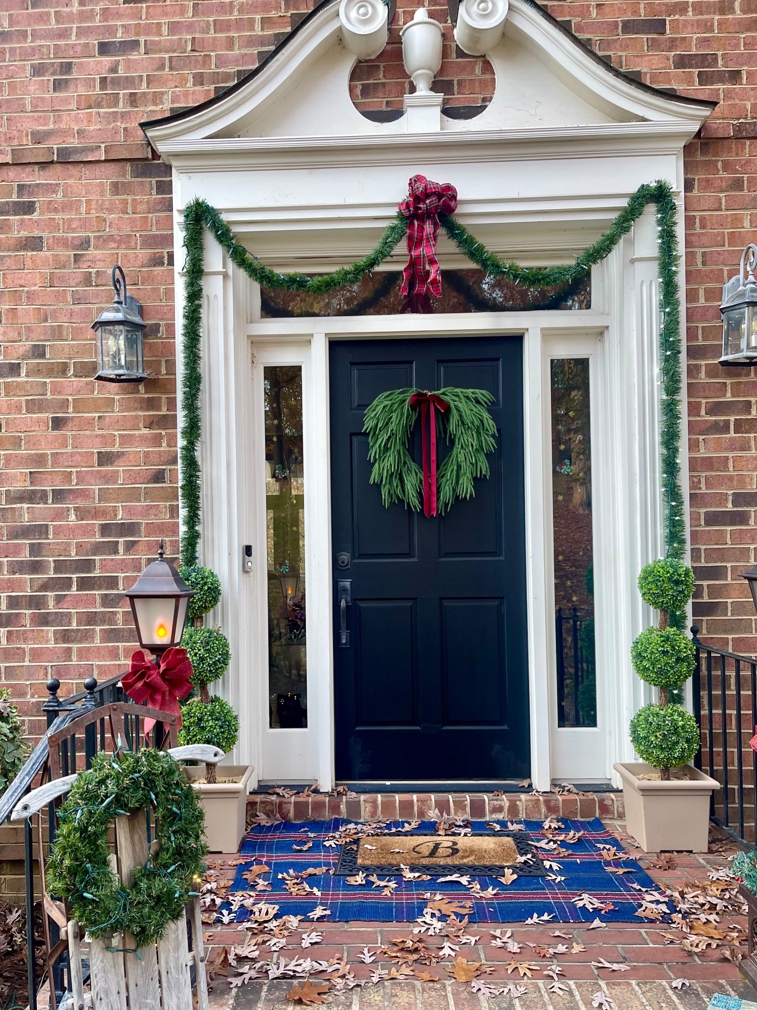 ✨Classic Christmas Front Porch Decor✨

Bring a cozy, traditional holiday feel to your front door with this timeless Christmas porch styling! 🎄💚 I layered the navy tartan plaid rug underneath our monogrammed doormat for that classic prep vibe, and paired them with these gorgeous triple ball topiaries for height and symmetry. The star of the porch is the Norfolk-style wreath with the deep red velvet ribbon — simple, elegant, and so perfect for Christmas. 🎀🌲 Everything is super affordable and easy to recreate!

Navy tartan rug, evergreen Norfolk wreath, artificial topiary trees, and our monogram “B” doormat are all linked so you can shop this whole front porch moment.✨

💫 Perfect for the holidays, Christmas hosting, and creating a warm seasonal welcome!

🎄✨ navy plaid rug • holiday front porch decor • Christmas wreath • outdoor Christmas decorations • classic Christmas porch • layered doormat look • artificial topiary trees • front porch styling • neutral Christmas entryway • Walmart Christmas finds • Amazon home decor • monogram doormats • festive front door décor • cozy holiday home styling ✨🎄

#LTKHome #LTKHoliday #LTKFindsUnder50

#LTKFindsUnder50 #LTKHoliday #LTKHome