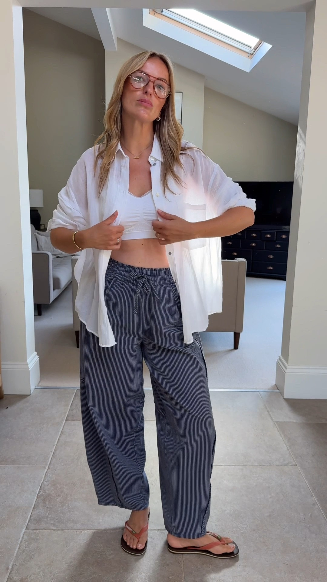 I’m talking about this shirt a lot recently , a must have in my summer capsules and a versatile piece to style with. 
On holiday I’ll wear for morning coffee, as a swimsuit cover at lunch and in the evenings paired with trousers, shorts and skirts. 
This is my favourite cotton one right now - it’s soft, lightweight, generous and a great price at £23    I’m wearing medium ( I would also wear large or XL - volume is great here! )


A comfy bralette just makes things easier again. Enabling you to open buttons without flashing too much - a lower neckline on a shirt ALWAYS makes it an easier wear. It also allows for a touch of summer layering as you can see through the shirt making the combo more intentional and so more interesting.
Paired with these excellent cotton trousers - relaxed & comfortable with a lovely barrel leg and pull on fit . I wear large in these .

#LTKsummer #LTKtravel #LTKstyletip