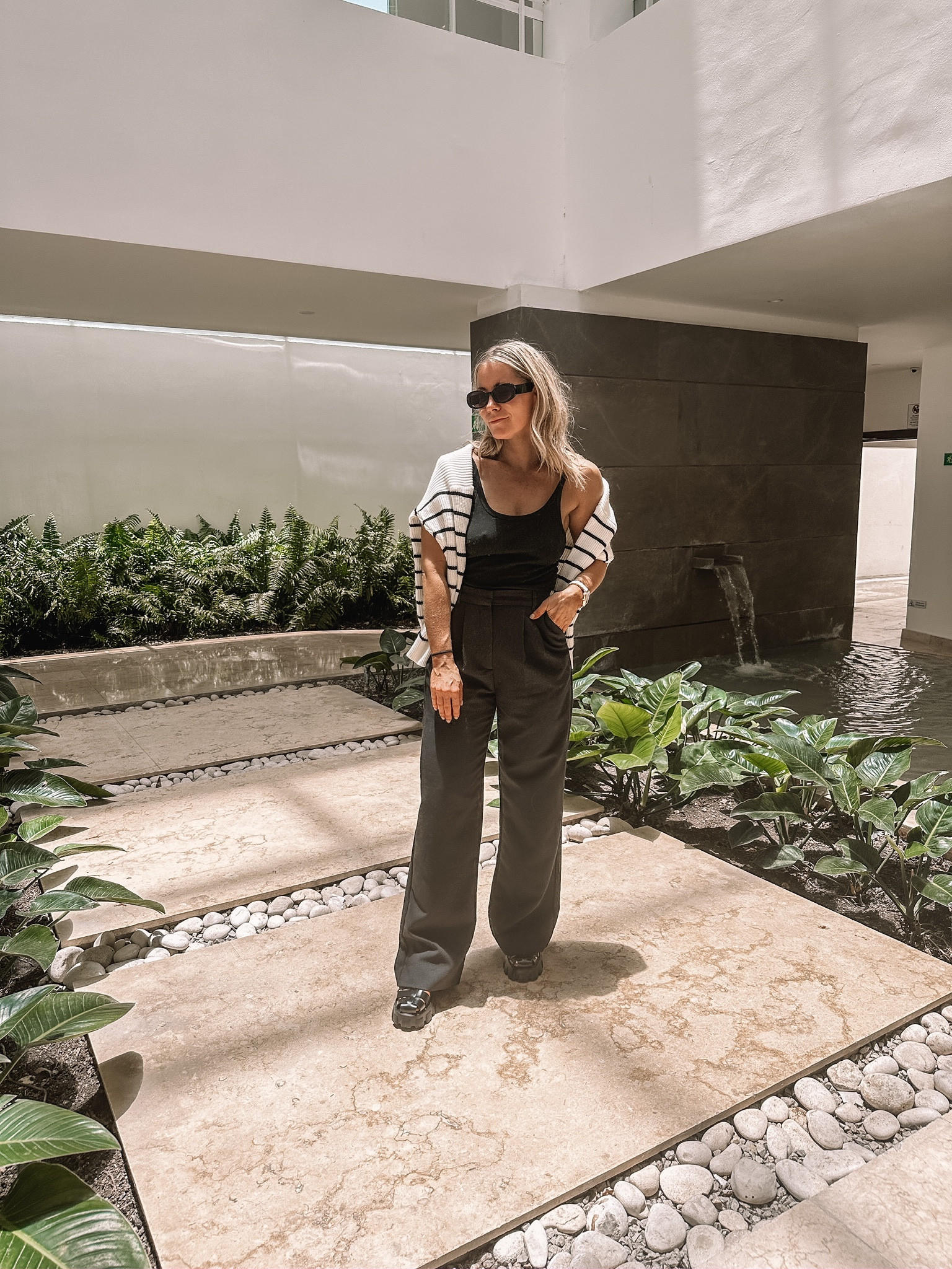 Black and white striped sweater, black tank top, black pants, Prada lug monolith fisherman sandals, travel outfit, high low fashion, resort wear inspo 

#LTKtravel #LTKU #LTKshoecrush