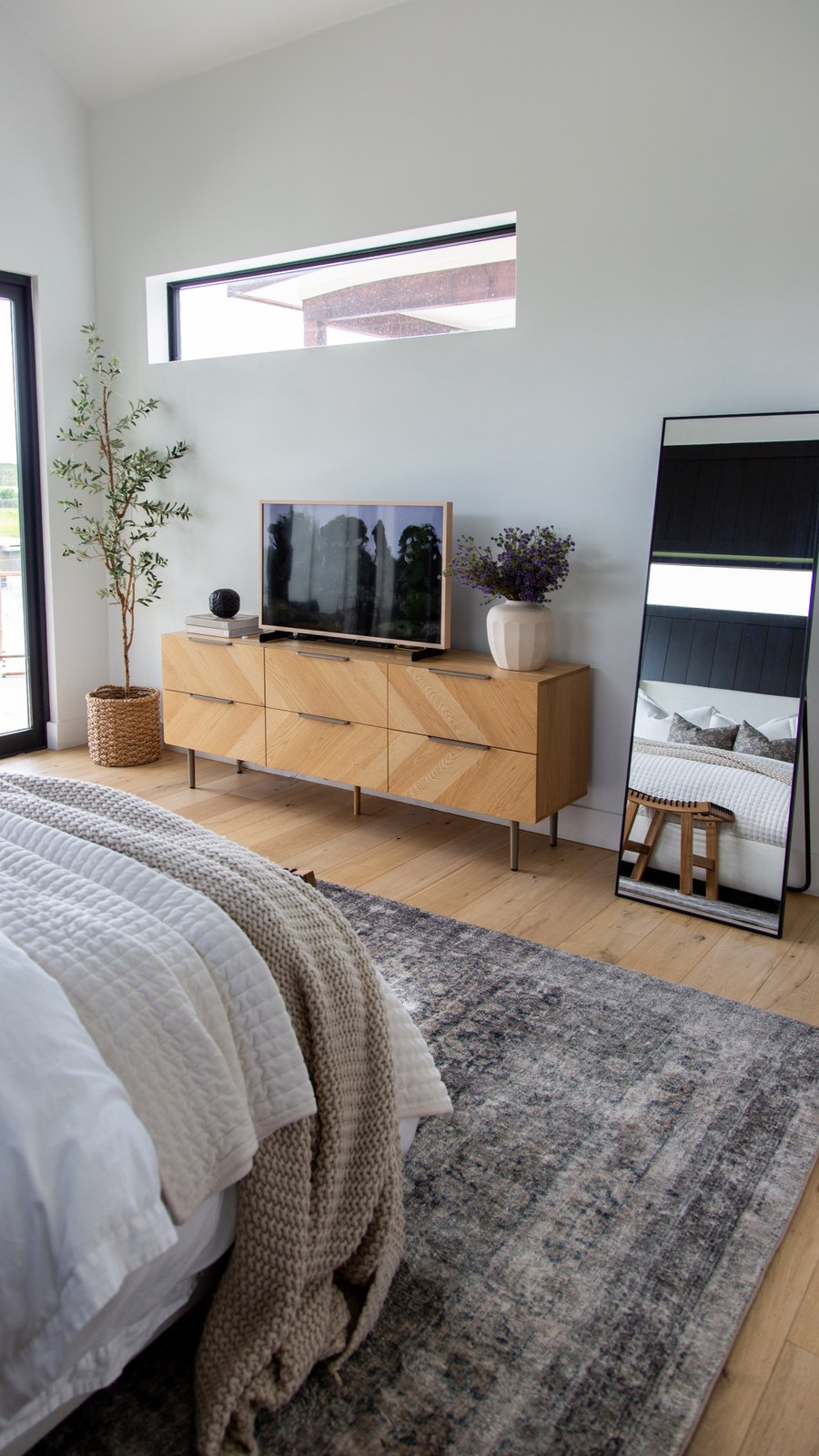 One of my favorite styled corners in our modern bedroom — our dresser setup blends…