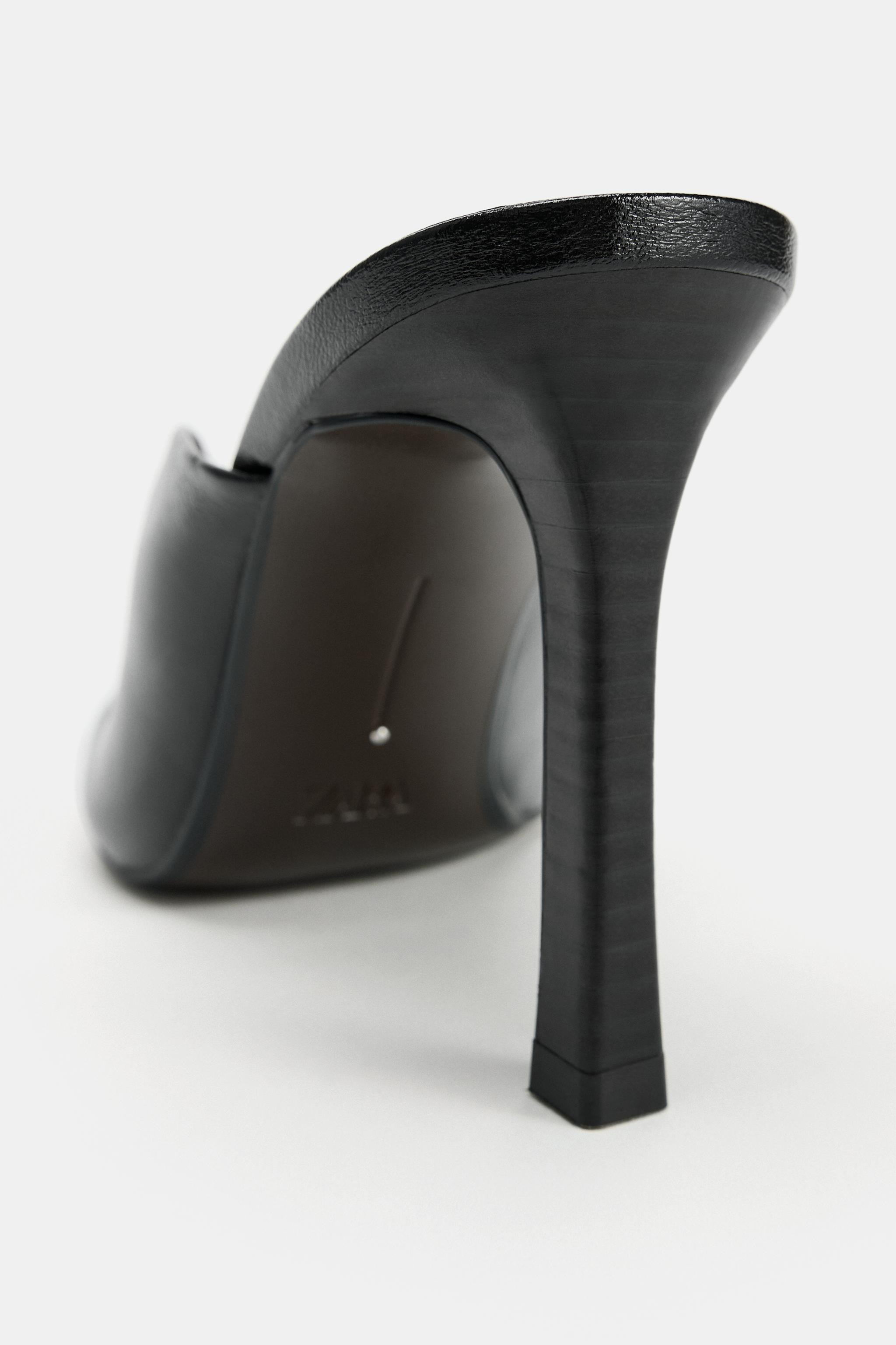 Leather mule heeled shoes. Topstitching detail on the front. V-cut. Slim high heel. Squared toe f... | Zara US