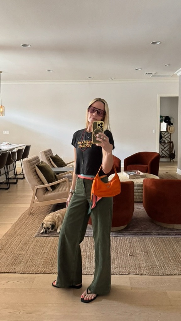 Wide-leg pants, an easy tee, a silk scarf tied as a belt & a Prada bag with a past life. 🫒🍊
•
Tee: Sunny Somewhere
Bag: Vintage Prada Tessuto Sport Mini
•
#LTKStyle #LTKFinds #LTKOutfitDetails #EstateSaleFind #WideLegPants #LTKstyletip #EffortlessStyle #LTKtrendedit #shopvinatge #graphictee #silkscarf #fallfashion 

#LTKStyleTip #LTKItBag
