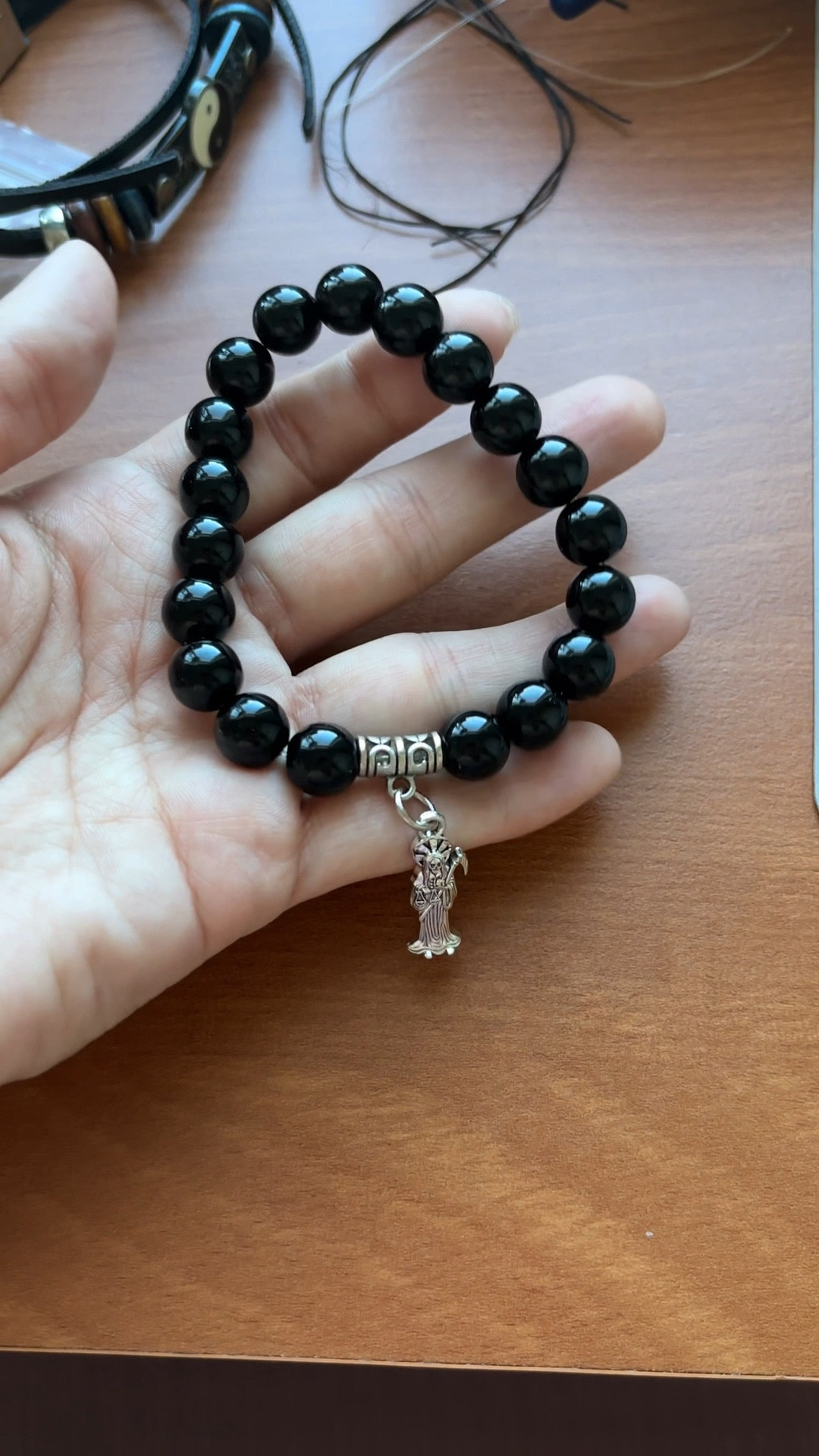 I got these Santa Muerte charms for another project but I couldn’t resist making a few pieces for my family and I 💙 What do you think should I make more of these styles for my store? #santamuerte #santamuertedevotee #santamuertejewelry #crystaljewelry #crystalbracelet #handmadejewelry