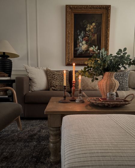 Living room, gold framed art, wicker vase, green stems 

#LTKhome
