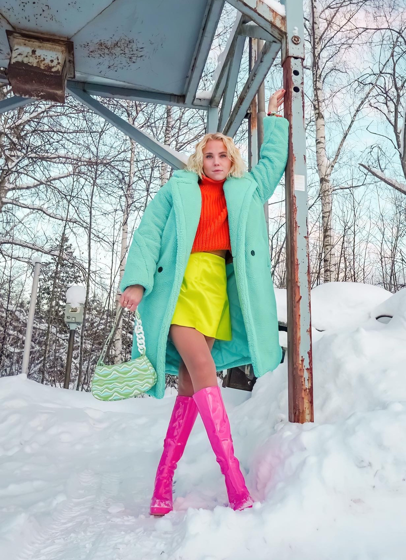 Colorful winter outfit. Turquoise borg coat, orange knit, neon green mini skirt, pink boots. 

#LTKstyletip #LTKshoecrush #LTKSeasonal