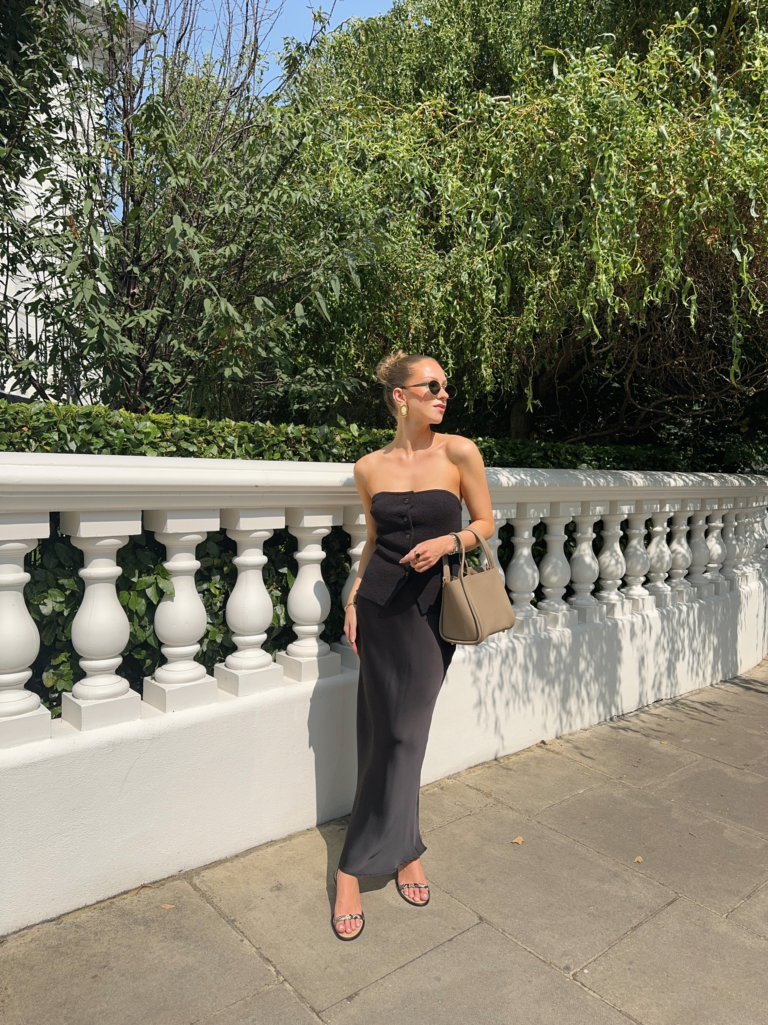 All Black Outfit, Satin Maxi Skirt, Bandeau Top, Tube Top, Strappy Sandals, Songmont Bag, Sunglasses Le Specs, H&M 

 #LTKuk #LTKspring #LTKstyletip