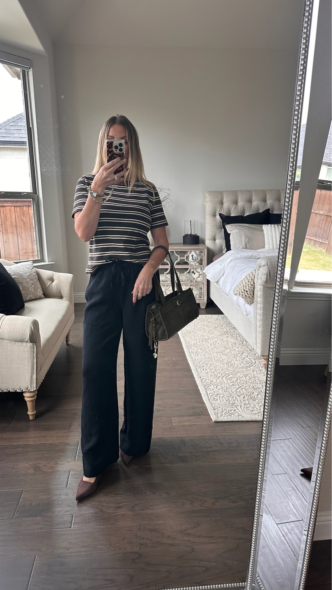 What I wore to a four-hour business meeting: relaxed black trousers, a striped tee, pointed shoes, and a structured bag. An easy business casual outfit that stayed comfortable and looked polished the whole time.

#LTKStyle #WorkwearStyle #BusinessCasual #Over40Style