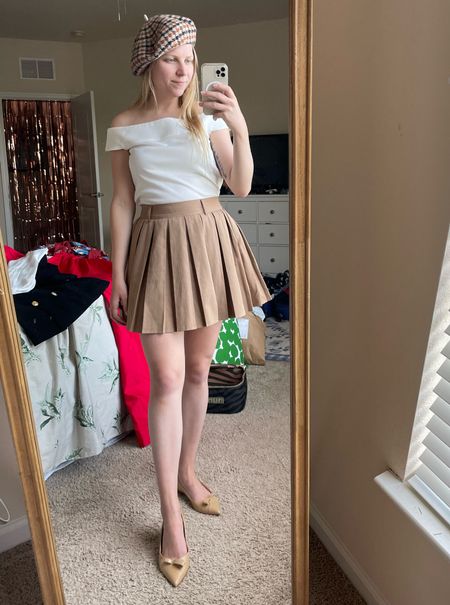 Preppy winter outfit. Off shoulder white top and tan pleated skirt  

#LTKSeasonal