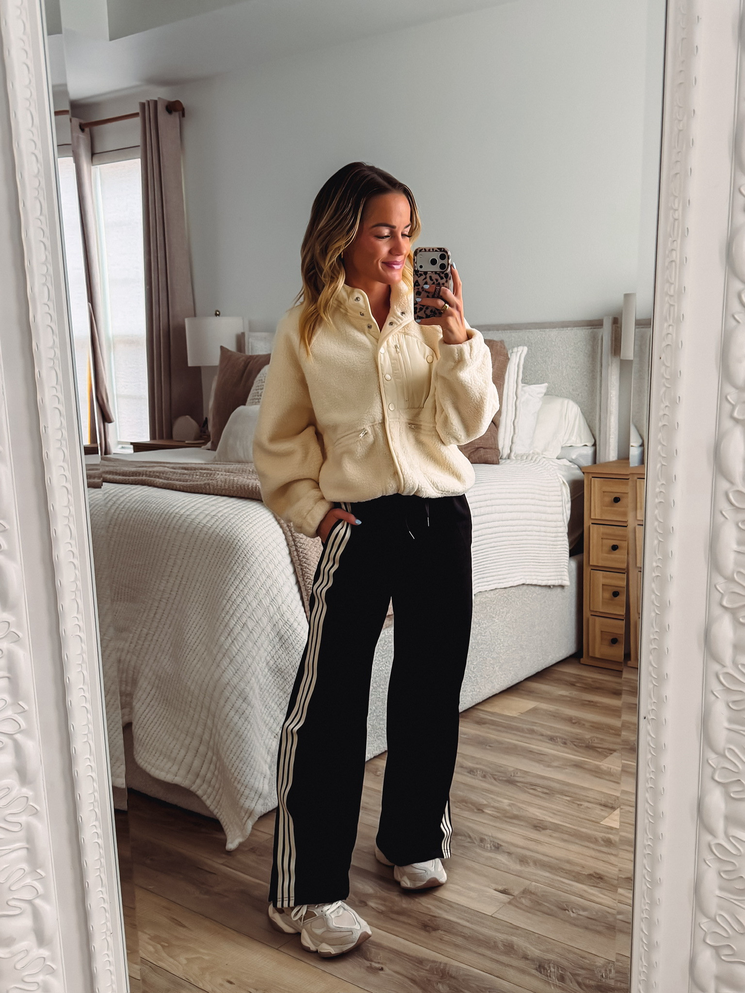 Sporty-cozy vibes for fall! I love this cream sherpa jacket with the snap-front and cinched waist paired with black side-stripe track pants. Chunky dad sneakers finish the look perfectly. So comfy and put-together for errand runs, travel days, or chilly morning coffee walks! 

 #LTKootd #LTKmomlife #LTKSeasonal