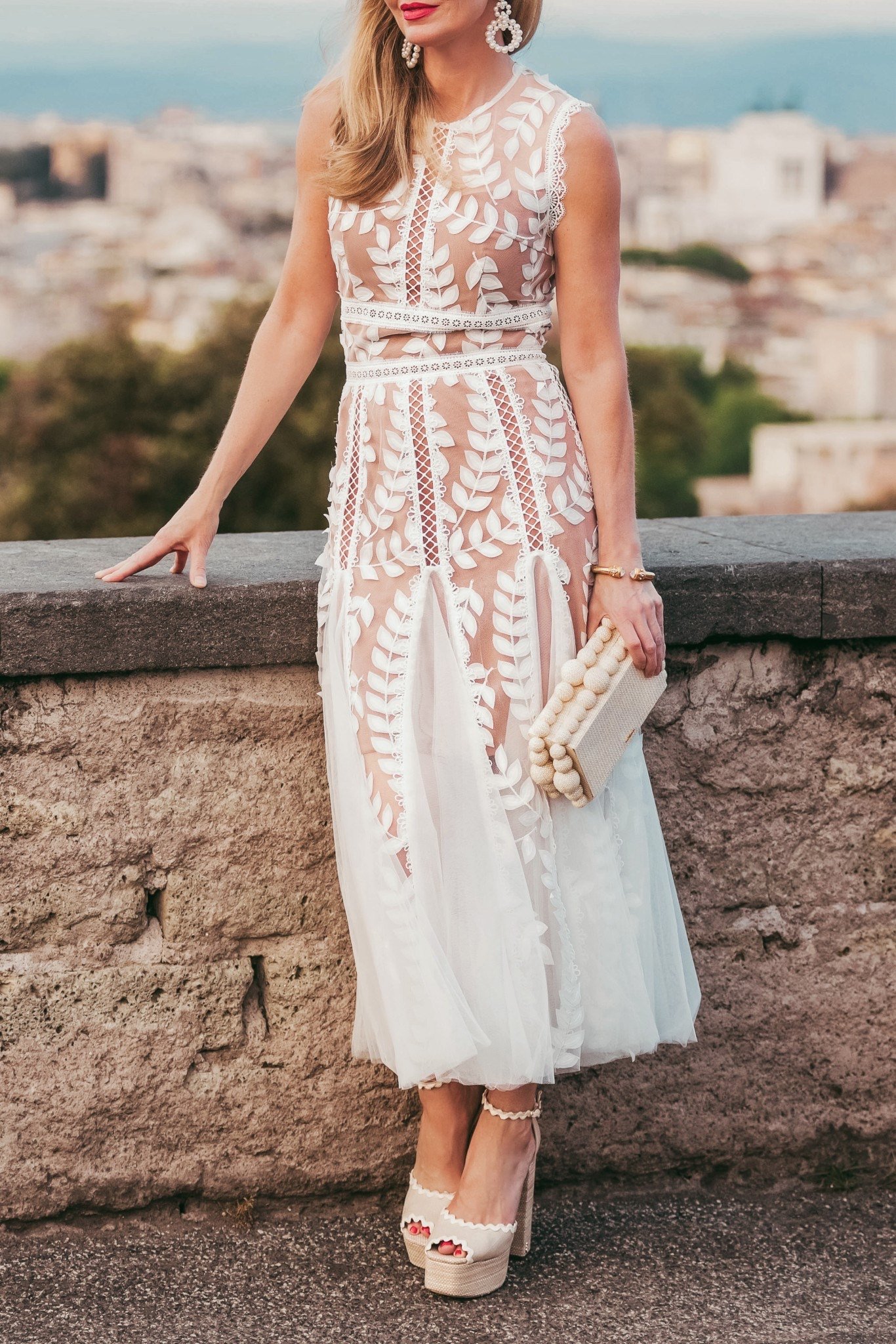 This stunning white dress is one of my all-time favorites. I’ve worn it many times, but my most memorable experience was wearing it to the Vatican City on a family trip to celebrate my 50th birthday. When we were sightseeing I dressed it down with some chic white sneakers and a white jacket, then switched to heels for dinner. It’s soooo special! It would also be a beautiful dress for Easter if you plan to dress up. 

~Erin xo

#LTKOver40 #LTKWedding #LTKSeasonal