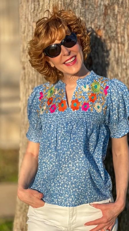 Gorgeous spring top with embroidered flowers, smocked puff sleeves and a smocked bodice. I love the way it flows down (so flattering!). Pair with white or denim!

#LTKover40 #LTKstyletip #LTKSeasonal