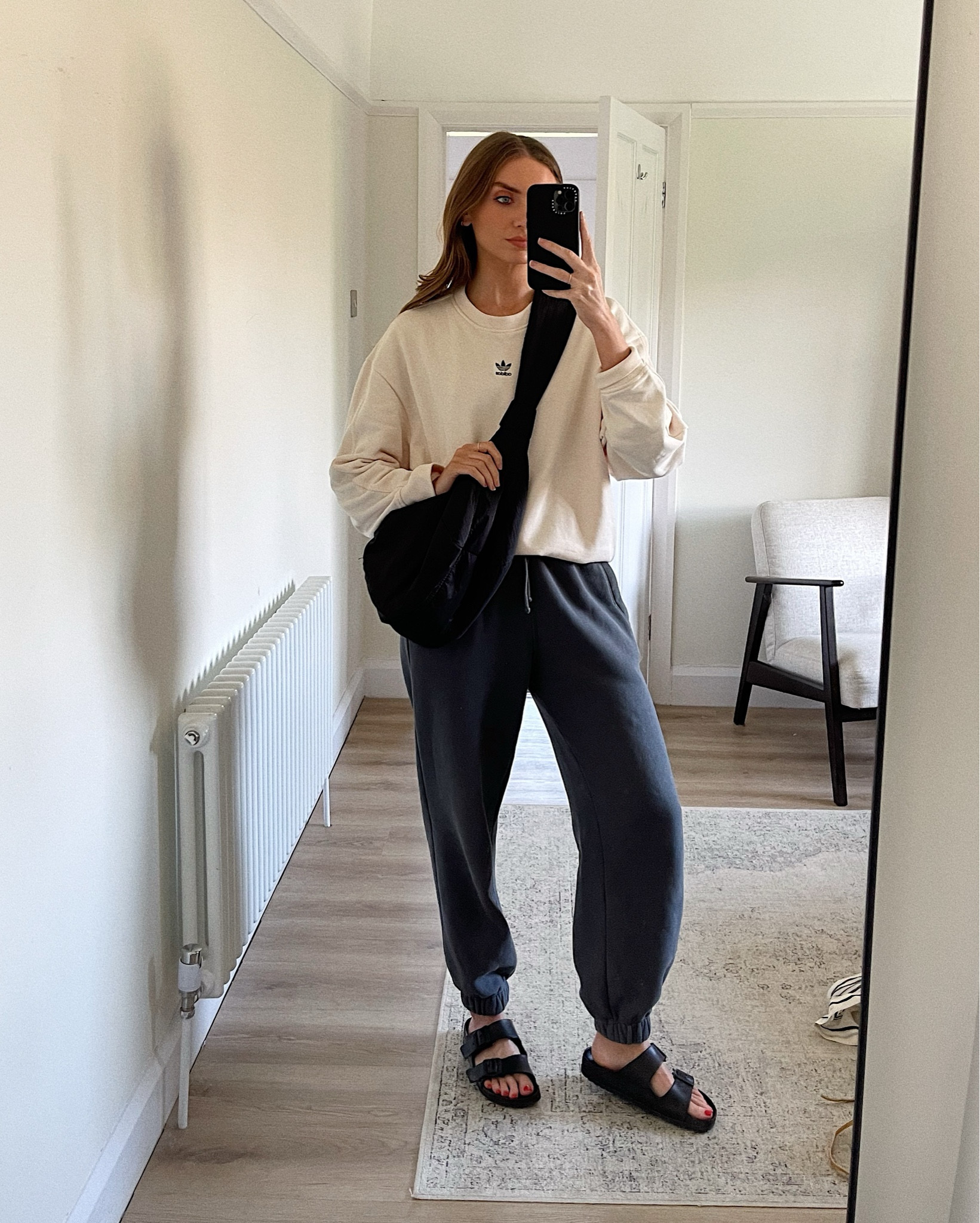 Comfy, casual outfit for of the day for running errands 
Small in the adidas sweatshirt 
Small in the Abercrombie dark grey joggers
New look black cross body bag 
Birkenstock Eva Arizona black sandals 


#LTKuk #LTKeurope