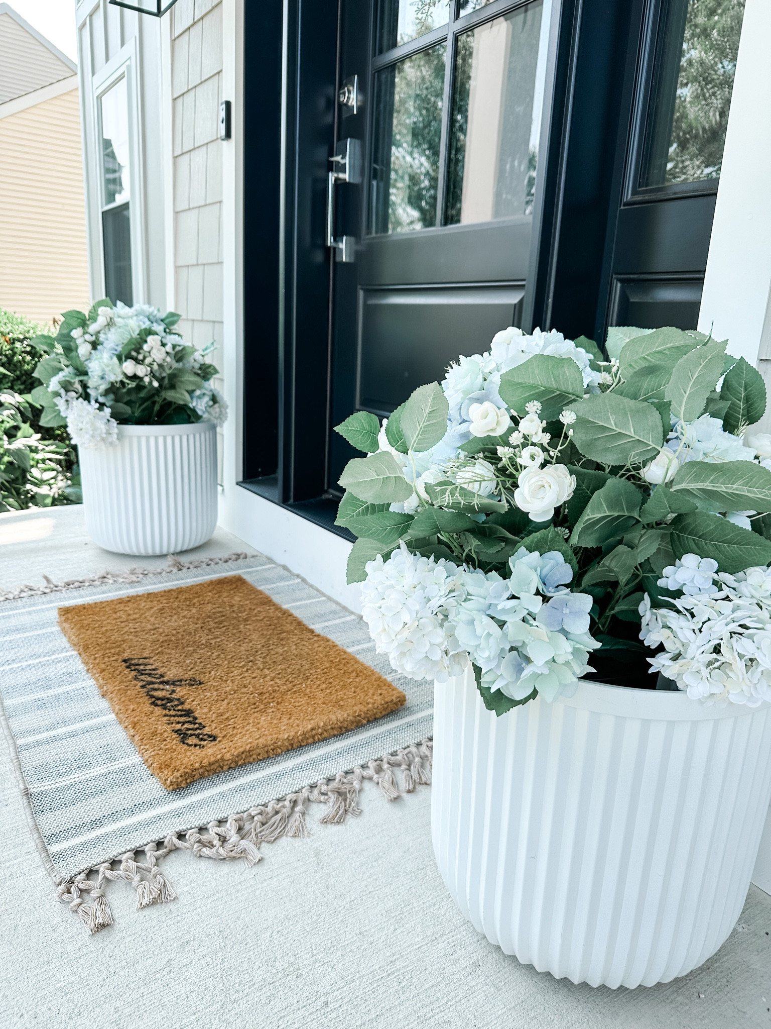 My Pottery Barn look alike viral planters are back in stock and under $30!

Front door decor, coastal doormat, front porch, spring, faux hydrangea urn filler, outdoor rug, doormat, coastal decor, beach house decor, beach decor, coastal home decor, coastal decorating, coastal interiors, coastal house decor, beach style, neutral home decor, modern traditional, traditional home decor,  hamptons style, Nantucket style, classic coastal, timeless, blue & white home decor, coastal grandmillennial, coastal grandmother, coastal granddaughter, Nancy Meyers style

#LTKHome #LTKStyleTip #LTKSeasonal