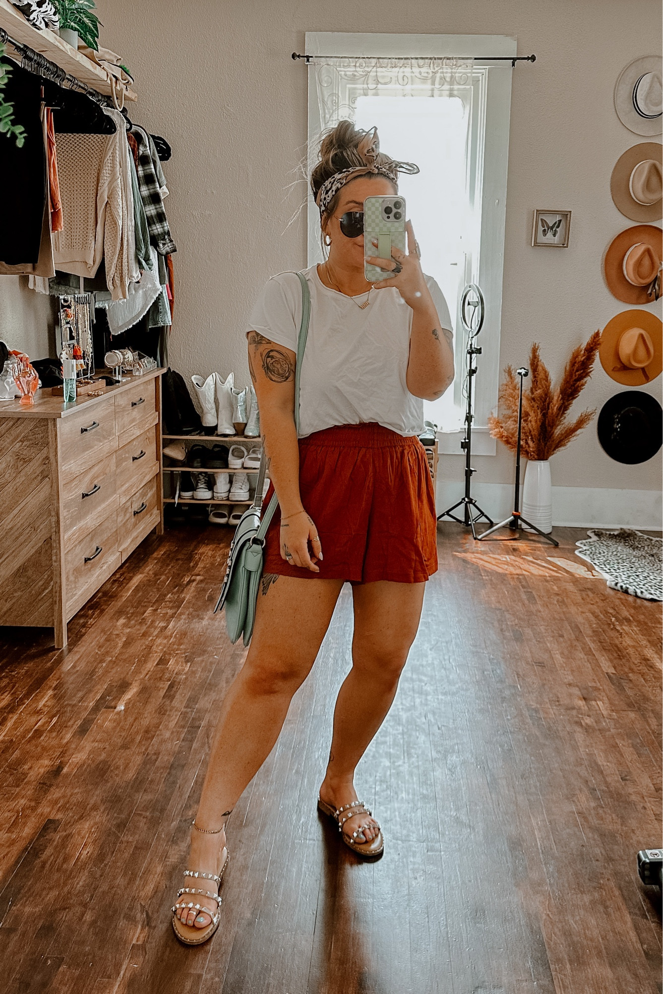 Summer meets bogo western 🌿🐆🌞 white cropped tee shirt (med) and rust orange brown flowy shorts with elastic waistband (med) paired with my studded Steve Madden sandals (tts). Accessories leopard bandana and blue teal boho purse with gold and turquoise statement ring 

#LTKSeasonal #LTKFind #LTKU
