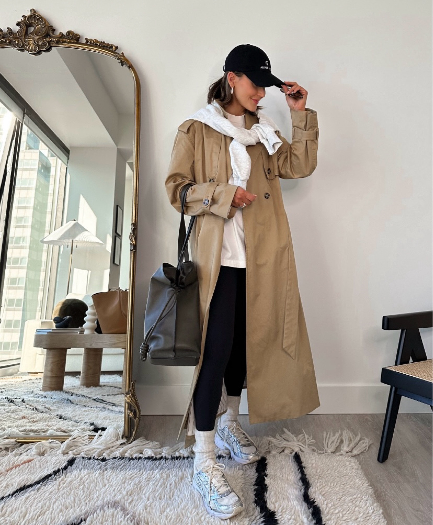 Style a trench coat in a sporty way on busy days that feature moody weather.  This laid-back look is perfect for running errands in or for meeting friends for lunch. While ultra-cozy, the combo features several trends that are “in” this fall: chunky dad sneakers, an oversized t-shirt, and tube socks. This trench coat gets a lot of wear and I couldn’t recommend it enough for the season ahead! I’m wearing a size XS for reference.

#LTKFindsUnder100 #LTKFindsUnder50 #LTKShoeCrush