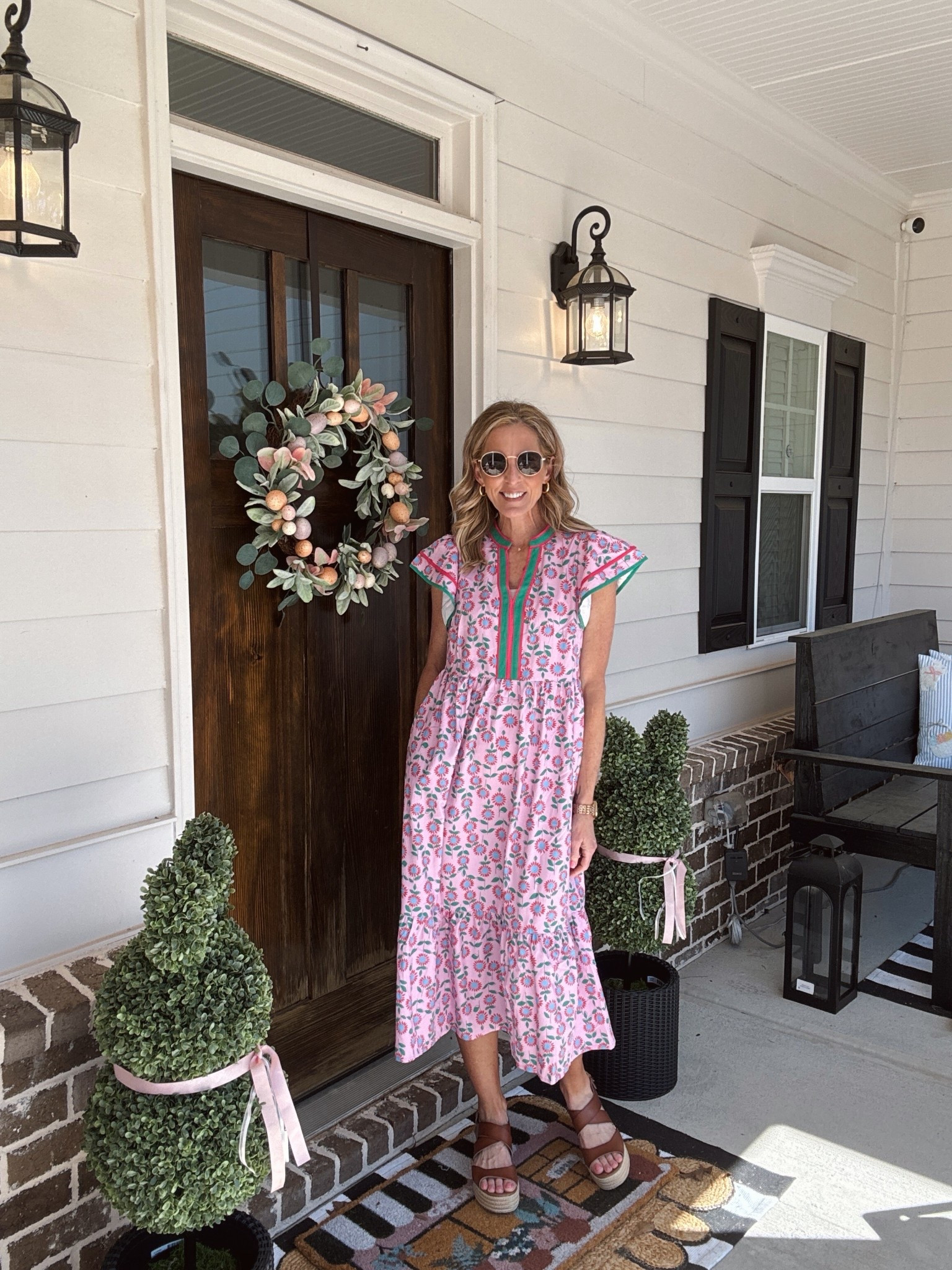 Amazon summer floral mini dress with ruffle sleeves in a Boho style tier has pockets and comes in six different colors wearing a size small , $40 