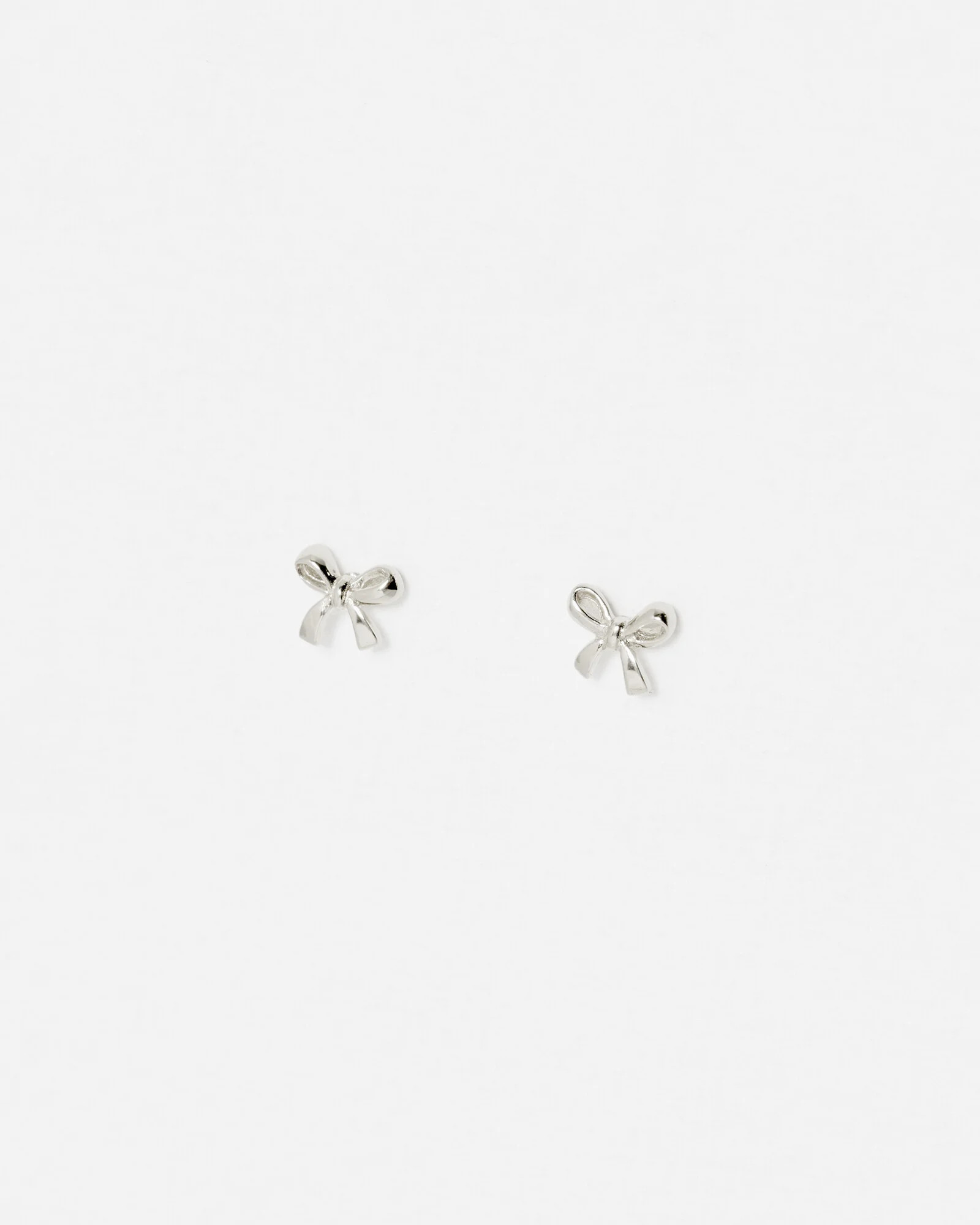 Paloma Sterling Silver Mini Bow Earrings | Oliver Bonas | Oliver Bonas (Global)