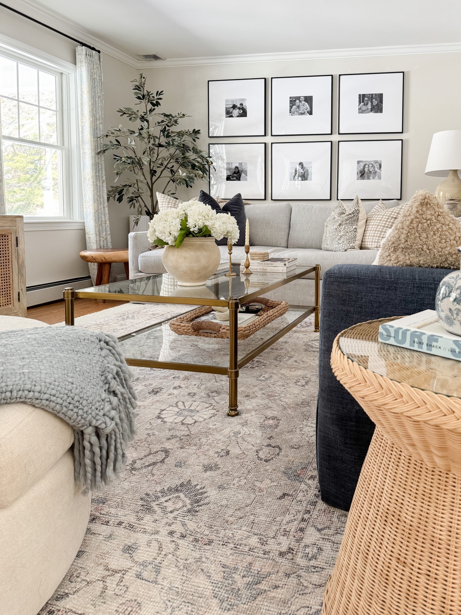 Coastal living room styled with neutral throw pillows, textured ivory rug, faux florals, and layered sofas for a relaxed high end coastal look.

coastal living room decor, neutral throw pillows, textured ivory rug, faux floral decor, layered living room styling, coastal home decor, neutral sofa styling, coffee table florals, light coastal interiors, sherricalnanhome

#LTKHome