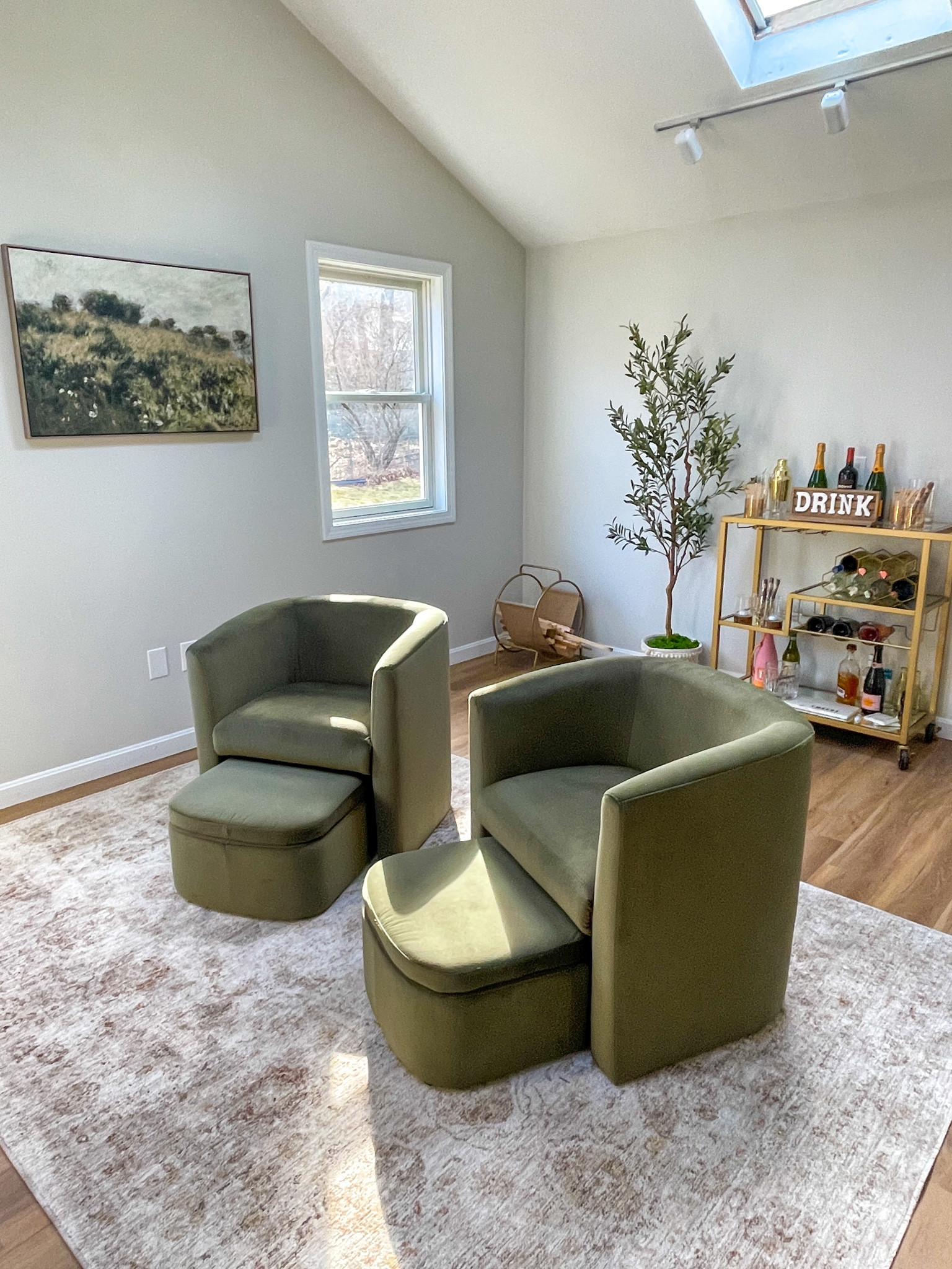 I love this study room that I have created! It is the perfect lounge space with these green club chairs, a bar cart, cigars, and this rug from Amazon! I added a 6 foot faux olive tree as well to tie in the colors. The other side of the room has a wood fireplace and bookshelves too! The perfect room for hosting cocktail parties or just reading a good book by the fire! 

#LTKHome #LTKParties