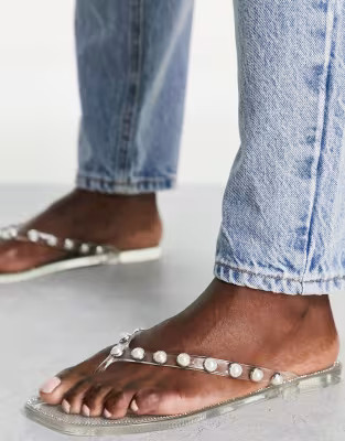 Truffle Collection pearl embellished jelly flip flops in clear | ASOS (Global)