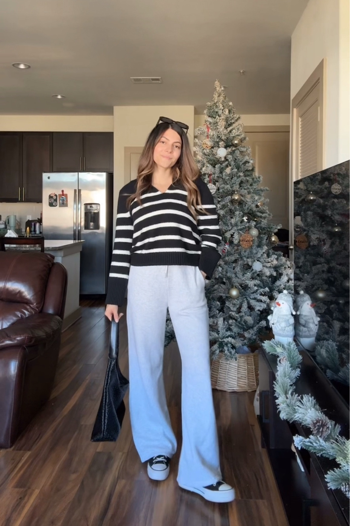 Cozy everyday winter outfit 🤍🖤 size small in sweater & sweatpants 



Wide leg sweatpants, striped sweater, notch neck sweater, black high top converse, casual winter outfit for women, black woven tote bag