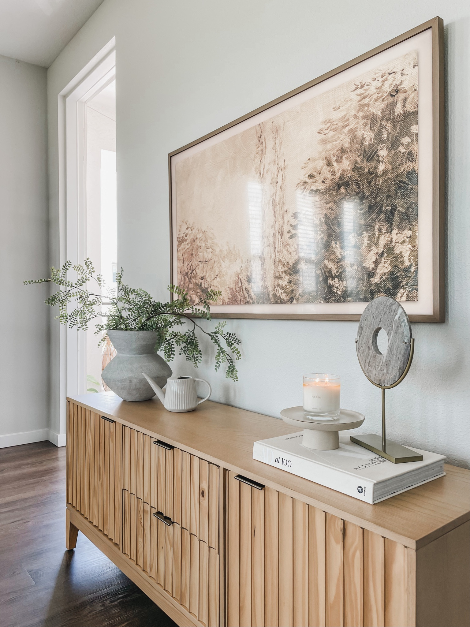 Spring console styling, frame TV Spring art, watering can, spring candle. 

#LTKhome #LTKSeasonal