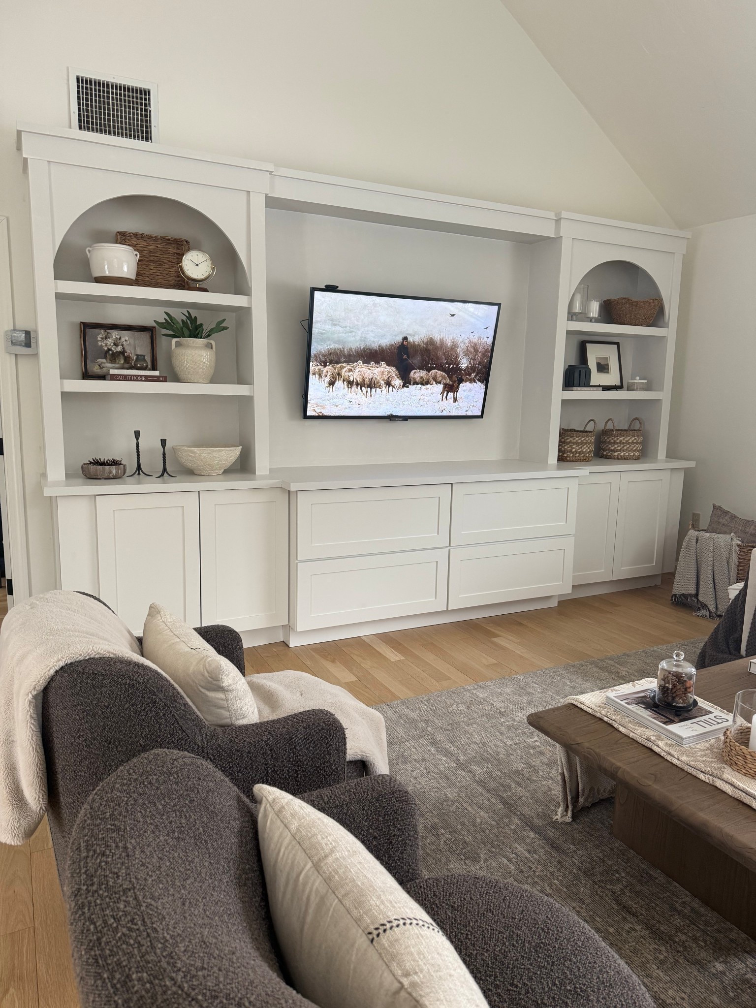 Built in and family room decor. My built in decor is getting there. Trying to fill the shelves with pieces that are timeless and affordable so they can stay that way for a while! I love to use different colors to off set the white. It’s been a work in progress 🤍

#LTKHome #LTKSaleAlert