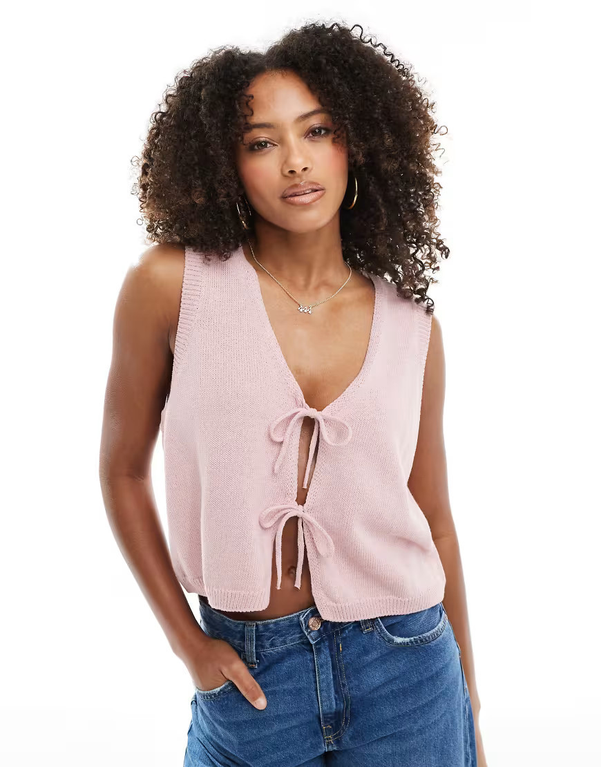 ASOS DESIGN v neck knitted tank top with bow tie front in pink | ASOS (Global)