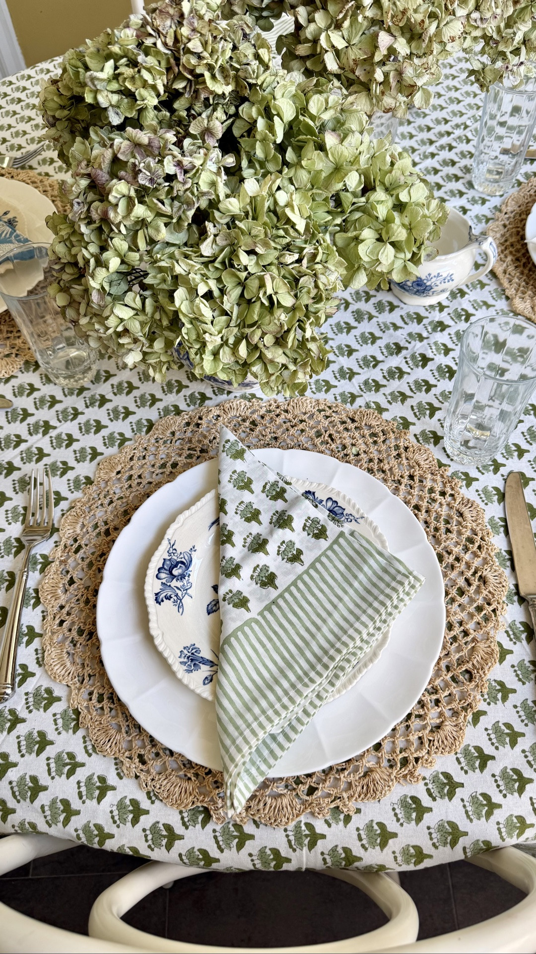 Been loving a fancy lunch lately, but I still like to keep things simple. These three tips will elevate even a super simple table setting!
1. Tablecloth! I love slightly relaxed 100% cotton ones, they look good even without attention on the ironing board. This one is an Indian import from a very affordable shop!
2. Use multiple dish sets—mismatch the salad plate and the dinner plate. Here I used my everyday white plates plus some antique salad plates from a partial set I have. 
3. ￼ Add interest and asymmetry with two vases instead of just one in the middle! Works great on a rectangular table, also adds drama here on round table.

#LTKSeasonal #LTKHome