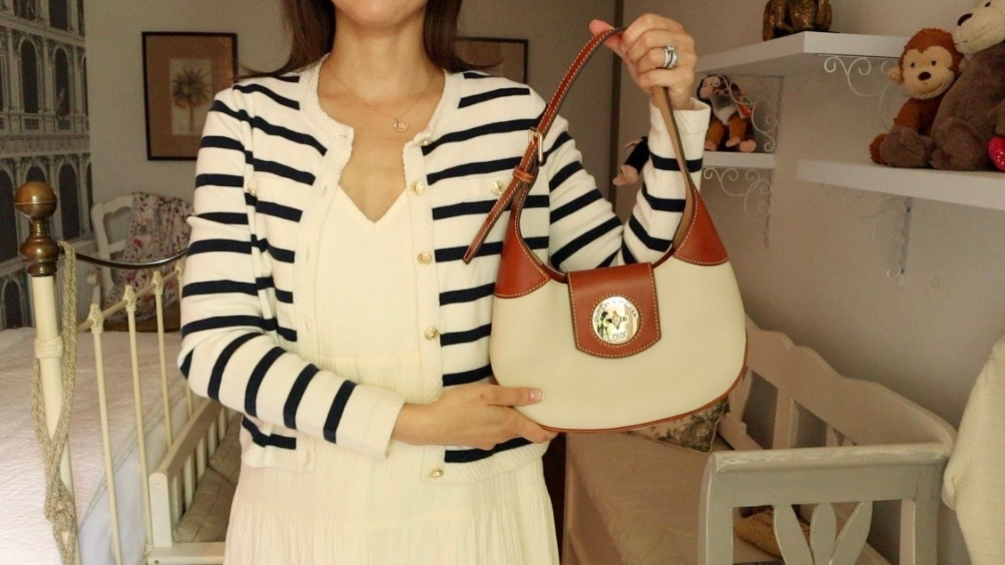 This summer, Dooney & Bourke has truly been my style companion. Their bags are the epitome of timeless elegance and functionality and this Pebble Leather Turnlock Hobo has been my most reached-for accessory of the season. 

From the stylish crowds at the Henley Royal Regatta to the gilded halls of Petworth House, this handbag has performed beautifully. I’ve been so impressed with its sturdy construction, roomy interior, and versatile design, a perfect match for the classic, feminine looks I gravitate toward.

👜 Bag: Dooney & Bourke Pebble Leather Turnlock Hobo – Even if this exact color is no longer available, the style is a true Dooney classic and well worth considering in any shade.

👗 Dress: Quince Organic Cotton Gauze Maxi Dress in Vintage Cream Light, airy, and endlessly flattering. This dress feels like wearing a summer breeze.

🧥 Cardigan: Lilysilk Gariana Striped Wool Cardigan – The nautical stripes bring structure and polish to the softness of the dress, an ideal balance.

I’m all about investing in pieces that elevate your style while standing the test of time. This outfit captures that philosophy perfectly.

Have you tried Dooney & Bourke bags before? I’d love to hear what your favorite summer accessory has been this season! 💬

 #DooneyAndBourke #SummerEssentials   #TimelessFashion  #LilysilkStyle #ElevatedEveryday

#LTKItBag #LTKTravel #LTKSeasonal