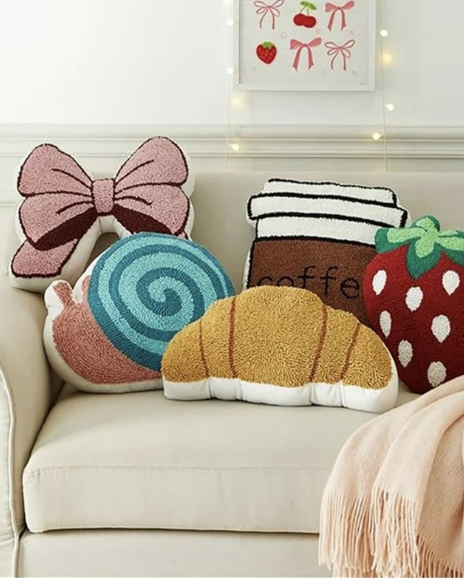 Walmart Whimsical Throw Pillows 🍓☕️🥐🎀

Adding a little personality to your space has never been easier! These adorable shaped throw pillows from Walmart are the perfect way to bring a playful, cozy touch to a bedroom, reading nook, dorm room, playroom, or even a coffee bar setup. From the sweetest strawberry and bow designs to a coffee cup, croissant, and whimsical snail, each pillow adds fun texture and charm without breaking the budget.

Soft, colorful, and conversation-starting, these accent pillows are an easy way to refresh your decor for summer and beyond. I love mixing a few together for a collected, eclectic look that feels both trendy and cozy.

Cute home decor, Walmart home finds, decorative throw pillows, bow decor trend, strawberry aesthetic, coquette room decor, whimsical home accessories, affordable home styling, dorm room decor ideas, cozy bedroom accents, fun accent pillows, cottagecore decor, playful home decor, budget-friendly decorating, trendy room accessories. 🍓✨☕️🥐🎀

#LTKU #LTKHome #LTKSeasonal