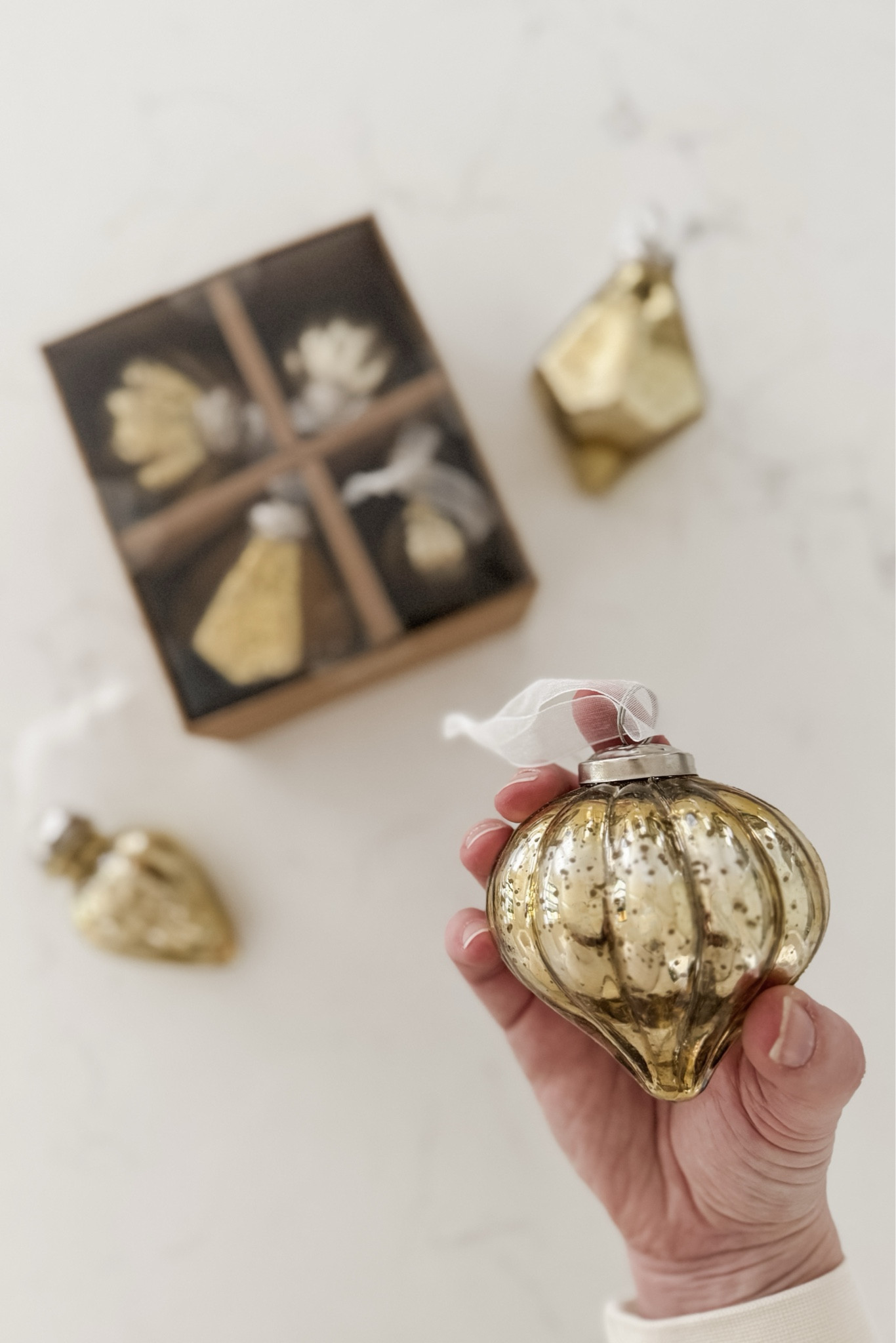 I am so happy with these beautiful mercury glass #LTKChristmas ornaments! I was looking for a very specific style and these were the perfect fit! I wanted the ornaments to be about 3" in size and in varying shapes.

We usually buy a 9-10 foot fresh tree so l bought four 4-packs of ornaments to be mixed in with my glittery gold starburst ornaments. They are our "filler" ornaments between all of our beloved annual "one-off" family ornaments.

#LTKHoliday #LTKHome