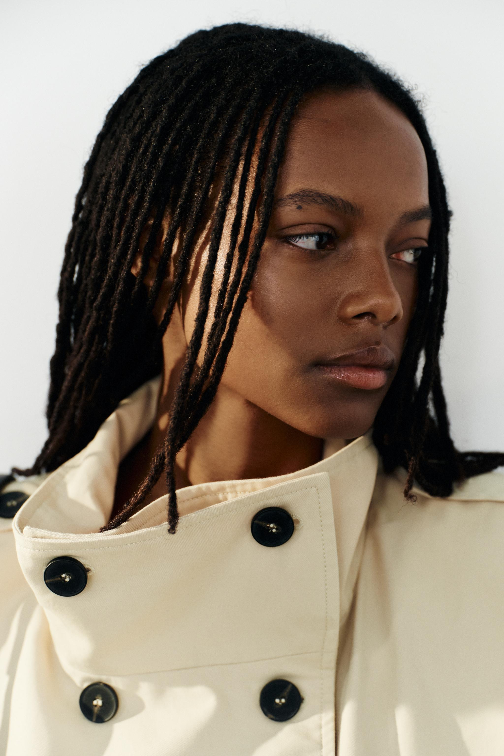 High-neck vest. Sleeveless with a tab and button detail at the shoulder. Pleated detailing. Front... | Zara US