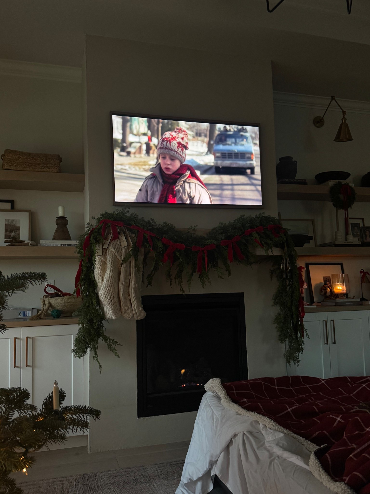 my faux garland is 30% off right now and the quality is so good! I’ve it for years and I have two 9ft garlands layered on my mantle. I use command hooks to hang it and then I linked the bow garland, lights, etc!