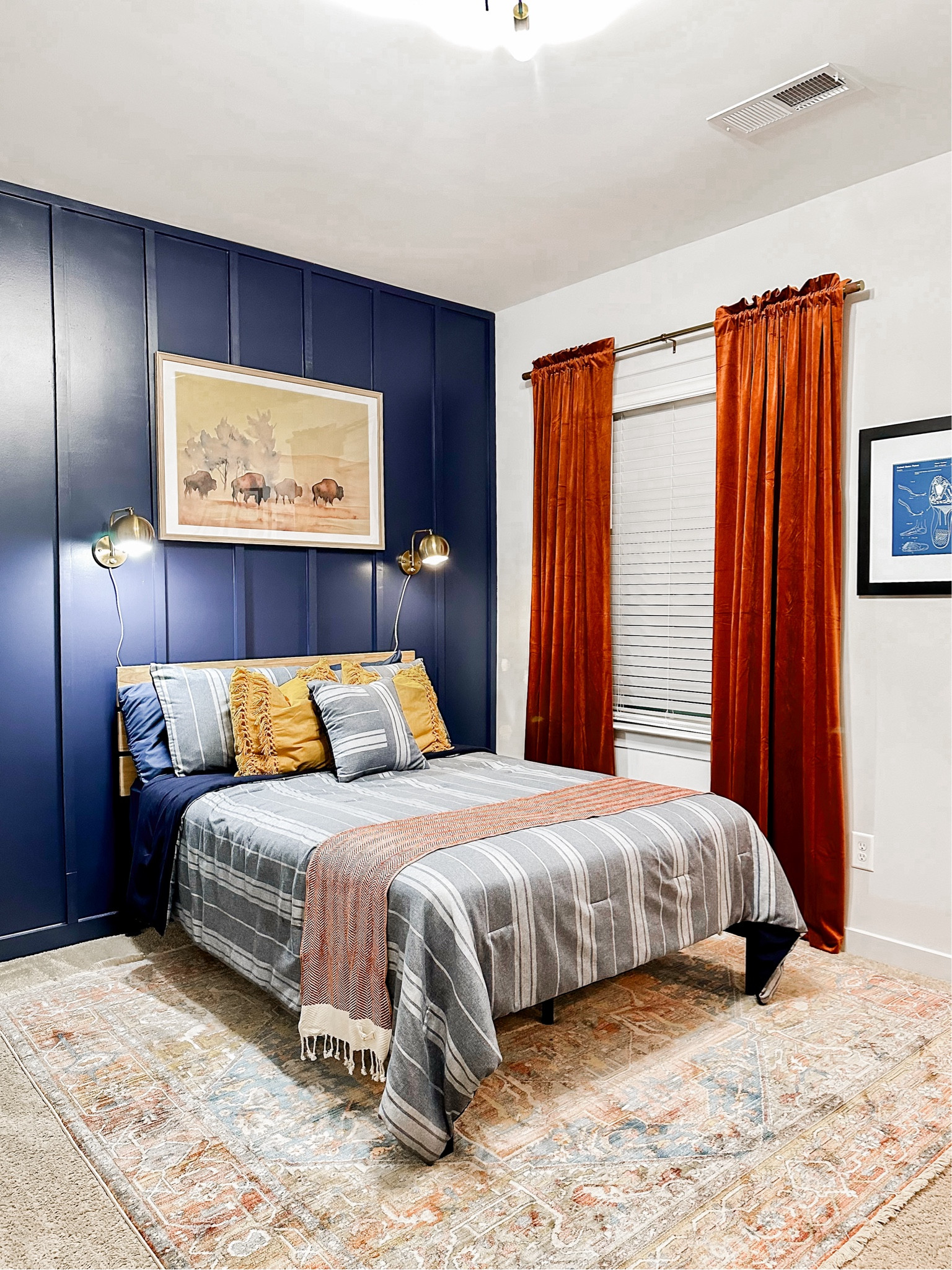 Create an inviting bedroom for the teen or young adult male in your house with these blue, rust and gold accents. A budget friendly and easy to pull together bedroom design for the every day mom!

#boybedroomdesign #blueandrustbedroom
#budgetfriendlybedroomdecor

#LTKhome
