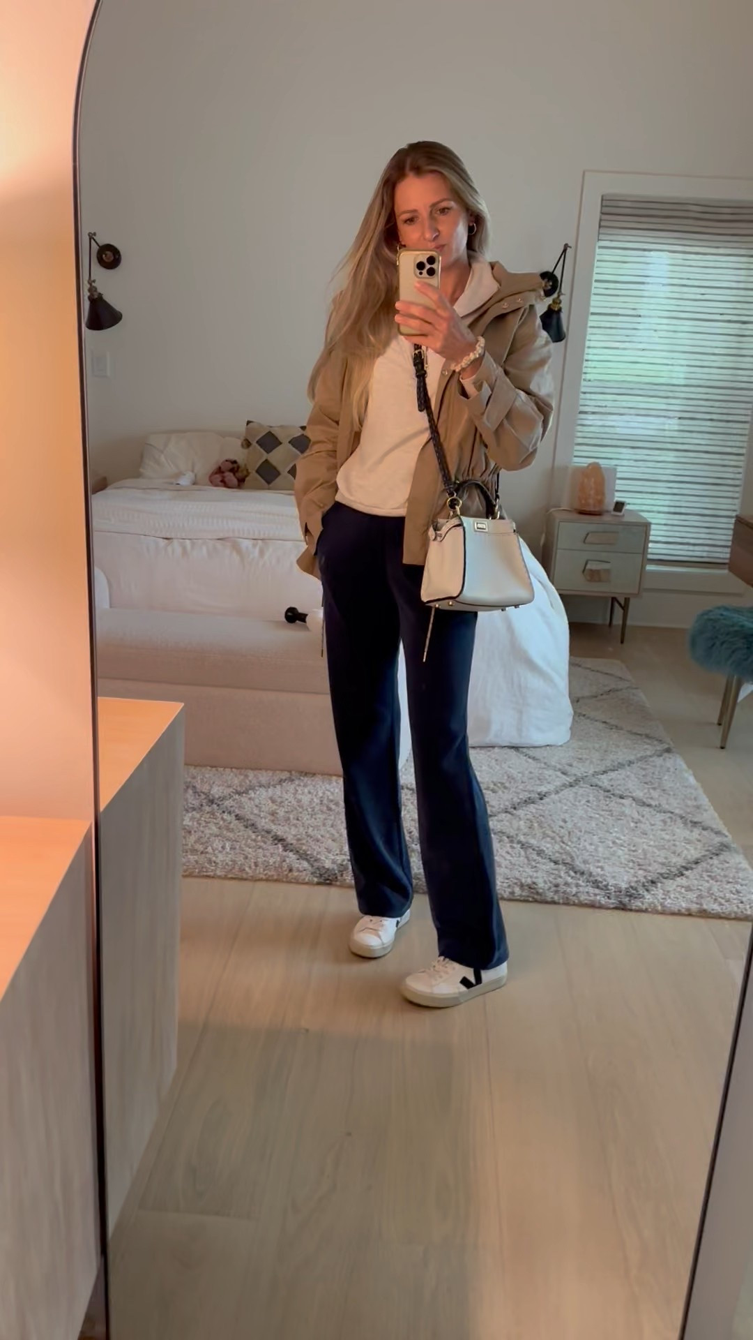 Casual fit check - rainy spring day edition. 

*pants size 4 / jacket size S / sweatshirt size XS / tee size small

#casualoutfit #momfit #springoutfit #springlayers #trenchjacket #widelegpants #navy #tan #offwhite #lululemon #softstreme #sneakers #veja #trench #traveloutfit #athleisure #varley #doublesoft

#LTKFindsUnder100 #LTKSaleAlert #LTKSeasonal