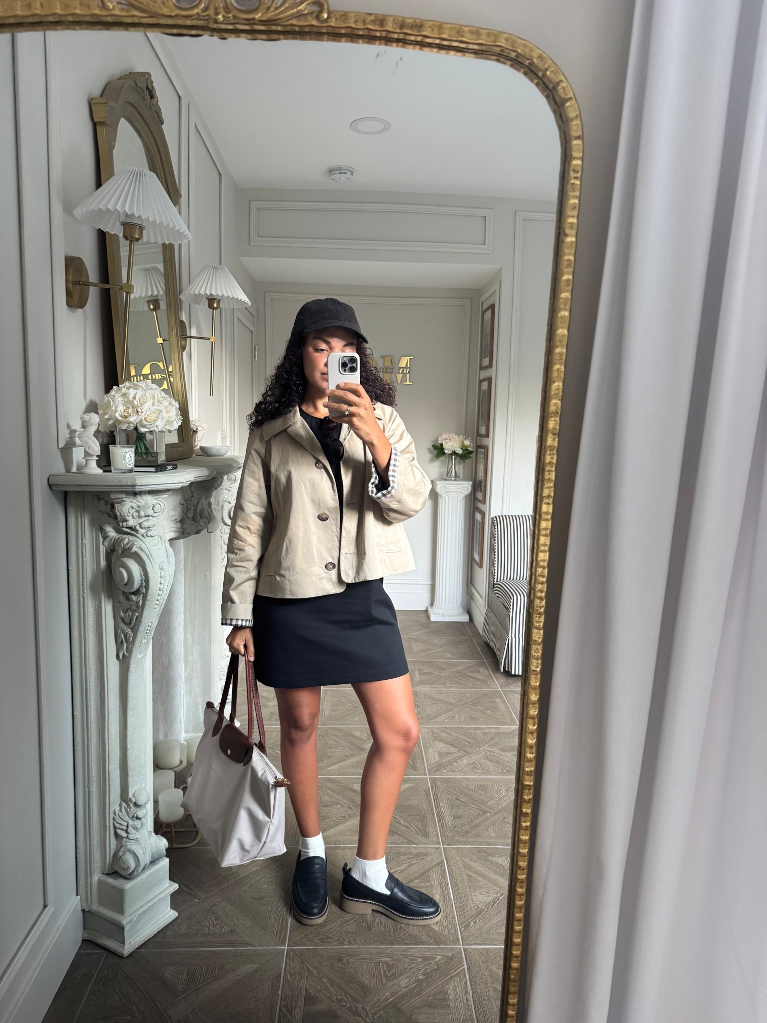 A crop trench is perfect for an early fall outfit. Styled here with a shift dress, Longchamp bag, loafers, socks, and a baseball cap 

#LTKSeasonal #LTKStyleTip