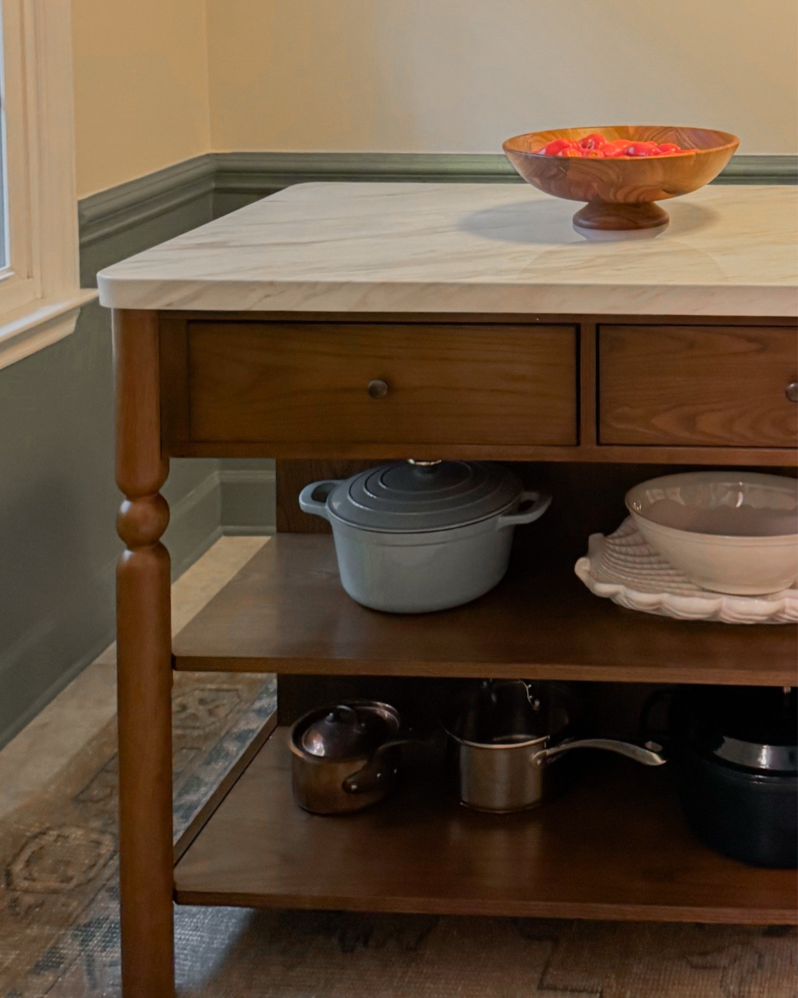 This kitchen island checks all the boxes. 
✔️ sturdy, made of real wood
✔️ storage with two drawers and two shelves 
✔️ adding counter space to my petite kitchen 
✔️ roomy enough for at least two counter stools
✔️ affordable
✔️ adorable (last but certainly not least)

I put it together by myself in one hour with only the provided Alan wrench but I would certainly recommend having someone help you. It’s heavy.