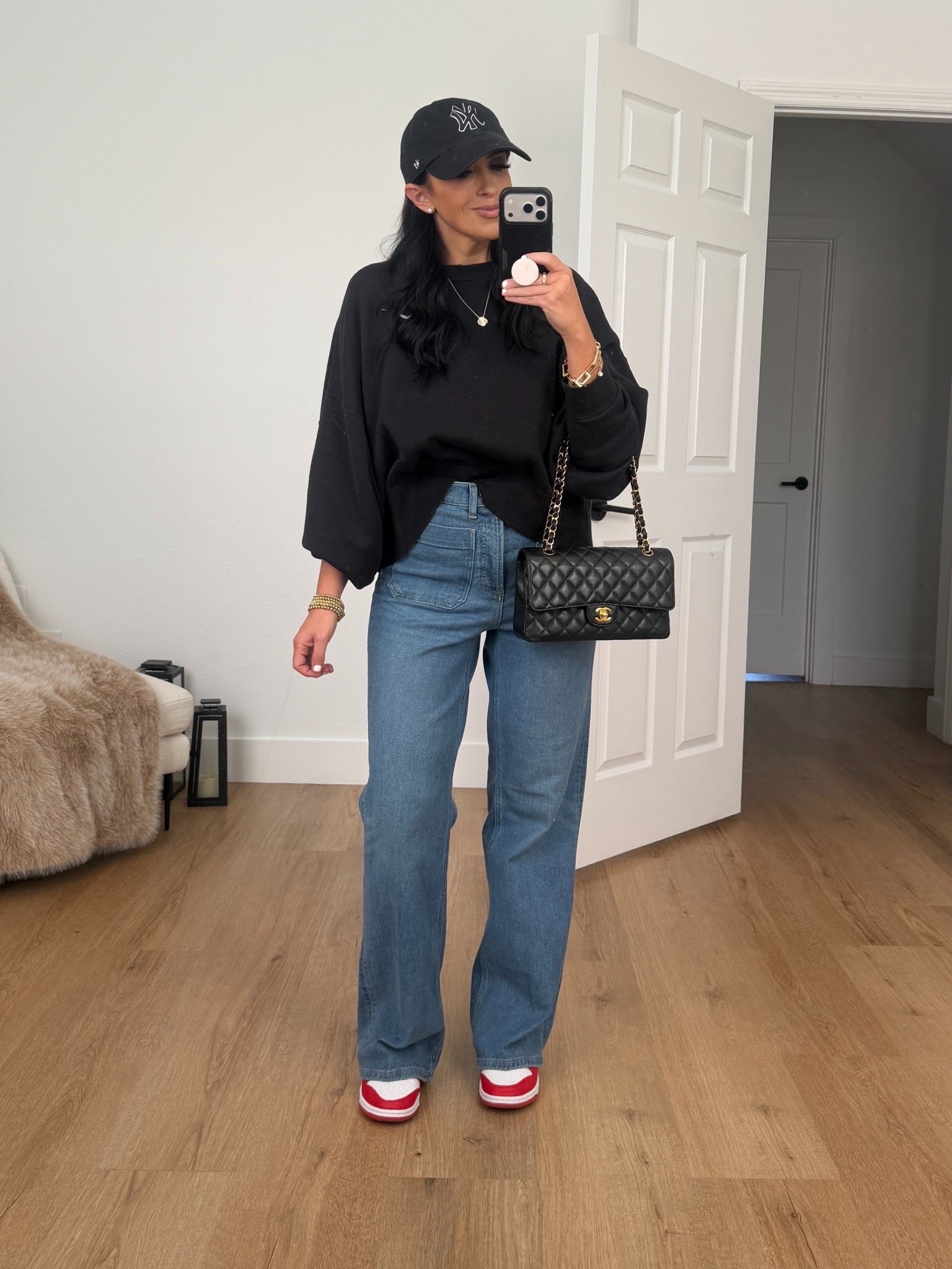 SPANXshape™ Authentic 360 Easy Flare Jeans with Patch Pockets wearing size medium. Nike Sportswear Phoenix Fleece Women's Over-Oversized Crew-Neck Sweatshirt wearing size small. 