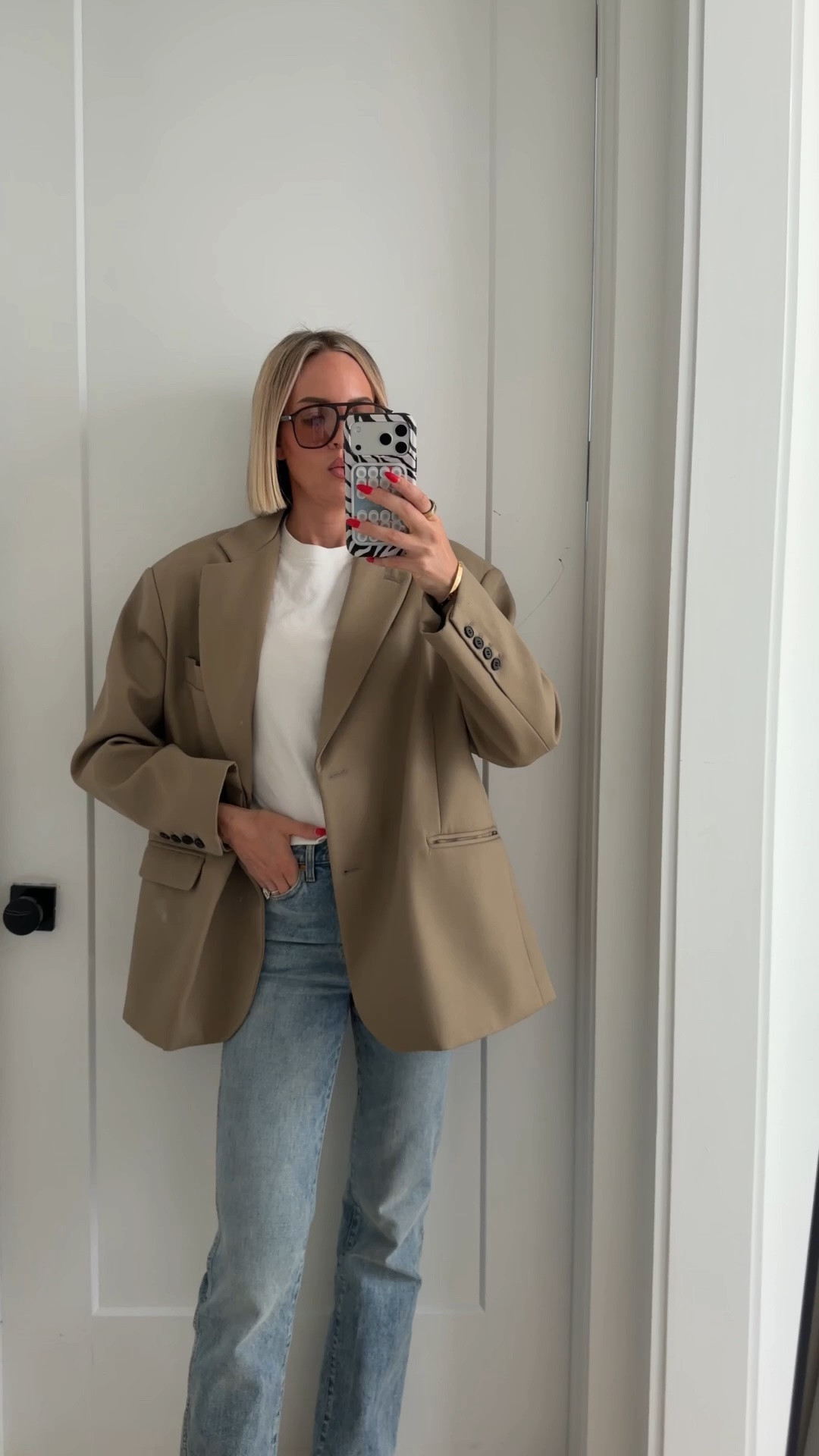 The blazer is from Frankie shop. I linked it below. I also linked the Anine Bing one that I also have that looks similar to this color. Wearing my usual size in my jeans. Wearing a medium in the tee￼

#LTKOver40 #LTKTall #LTKWorkwear
