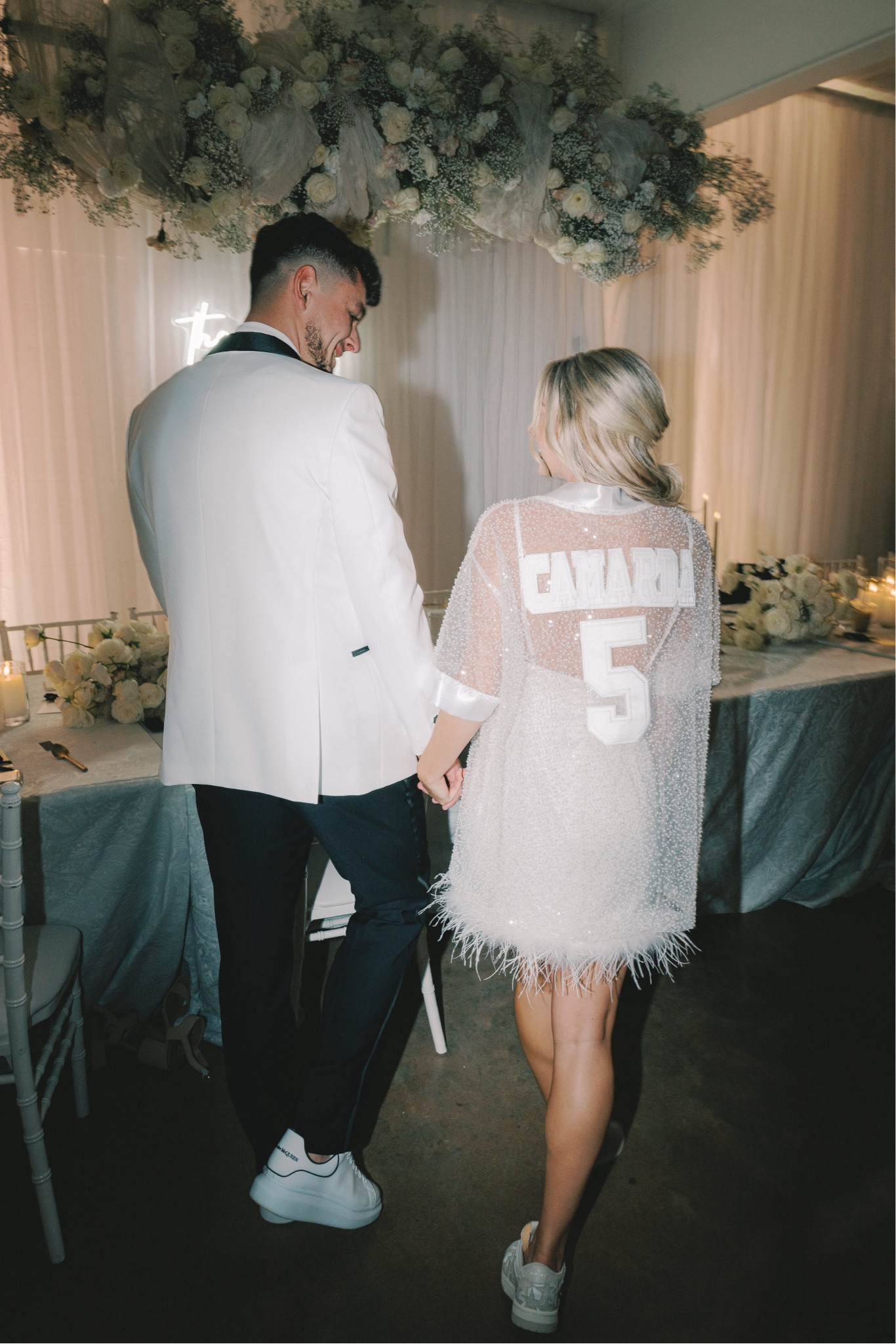 Jersey was custom but wearing it over a white more to come silk dress with amiri shoes 