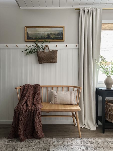 Entryway decor, straw tote, faux florals, hearth and hand wood bench, pink throw blanket, studio McGee throw pillow, beadboard with peg rail, etsy art, brass framed art, pottery barn dupe curtains, woven wood shades, target finds, amazon finds

#LTKstyletip #LTKhome #LTKFind