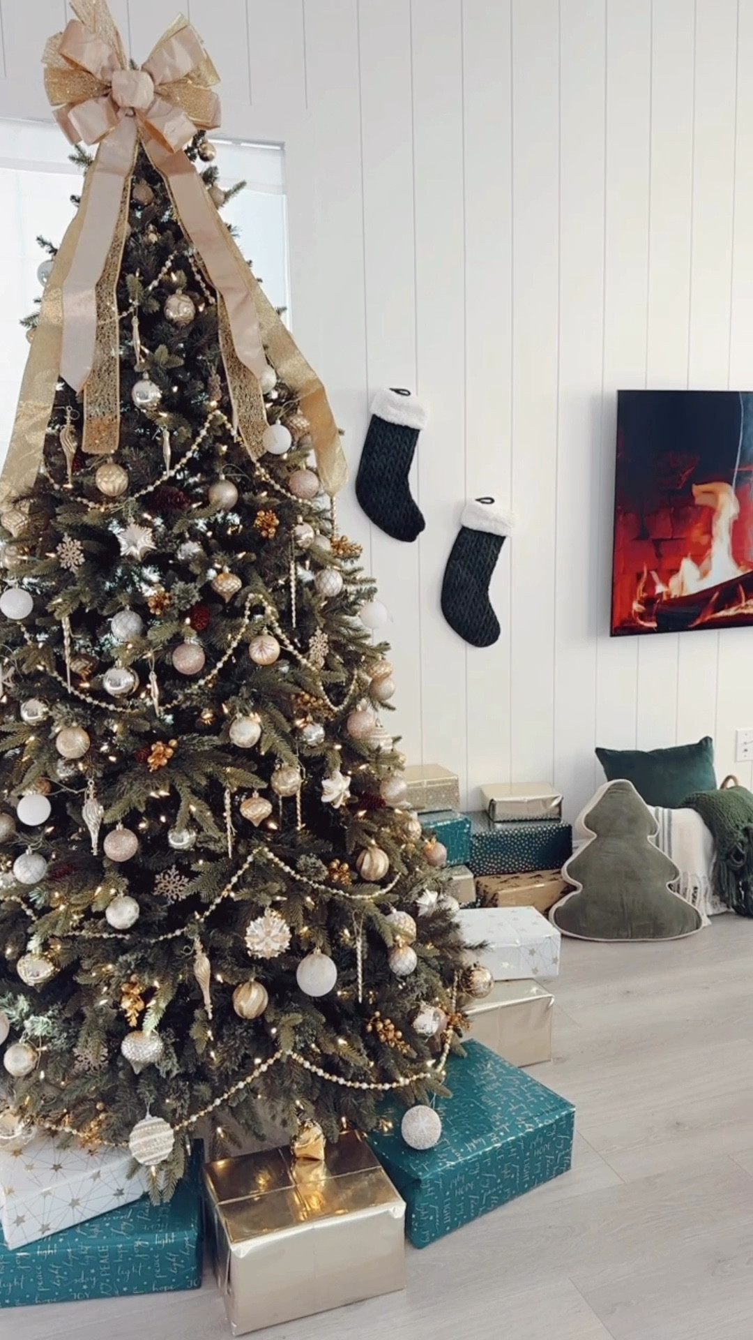 Christmas Tree Decorations + Holiday Living Room Decor 🎄✨

Our 7.5 pre-lit artificial Christmas tree is over $70 OFF at Lowe’s. This Christmas tree has lasted us years. I love how it looks realistic with the pine cones!

This year, we used a variety of white and gold ornaments. This made for an elegant + traditional Christmas tree aesthetic. I matched the colors of the Christmas tree with green, gold, and white wrapping paper. We also strung a gold and white beaded garland on the tree and topped it with an oversized gold bow. This ribbon bow tree topper came pre-made which was very convenient. To add pops of glitz and glamour to the tree, I added gold Christmas stems. To add some texture, I used a knitted white tree skirt that has lasted me years. In our blanket basket and blanket ladder, l added green and plaid blankets to match and cozy up the space. Don't forget to hang the green stockings up  

#LTKHoliday #LTKHome #LTKCyberWeek