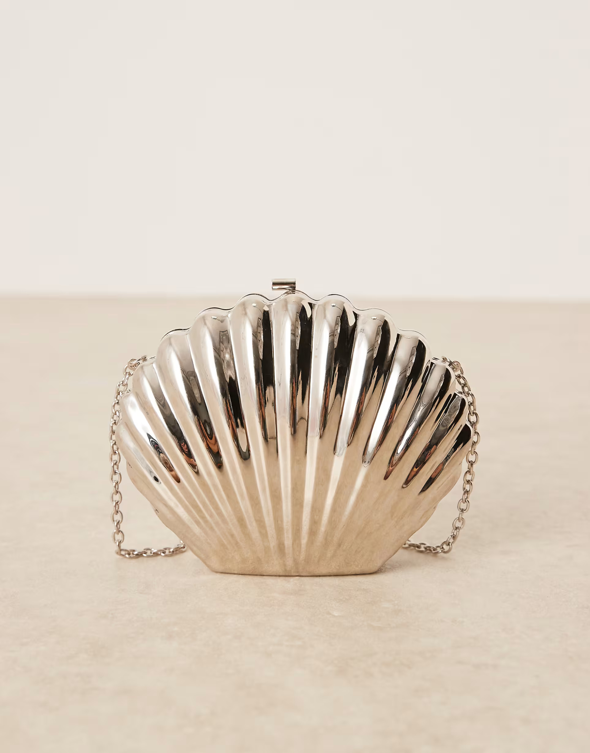 ASOS DESIGN shell metal clutch bag in silver with crossbody strap | ASOS (Global)