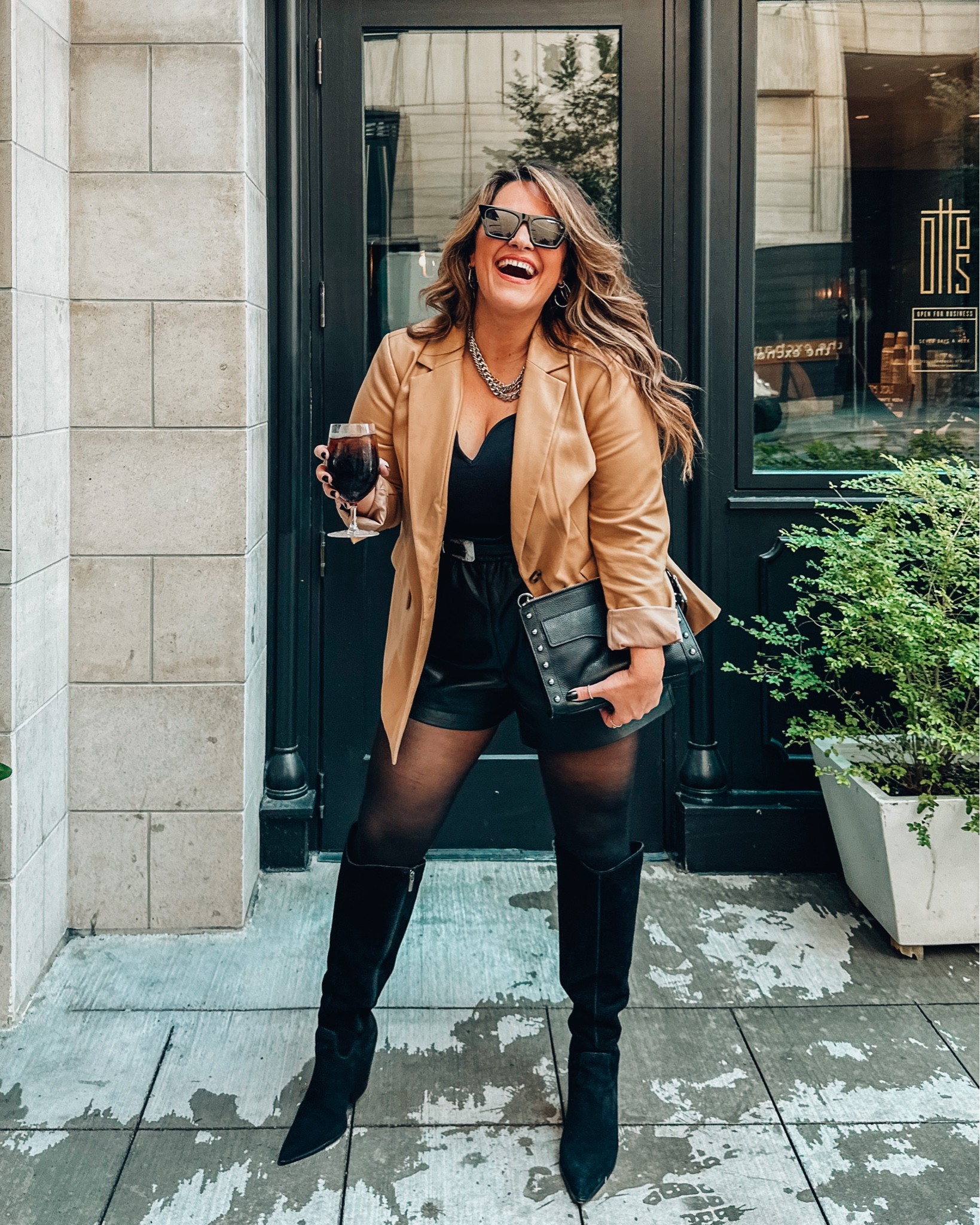 Todays midsize fall outfit for the LTK Con 
Vegan leather blazer size 14 Walmart
Corset stretchy top large 
Western belt xl
Vegan leather shorts are express and I got an xl for a loose fit 
The best tights that don’t squeeze wearing an xl 
Tall black knee high wide calf boots 
Layered mixed metal necklaces 
Amazon sunglasses
Studded bag 
