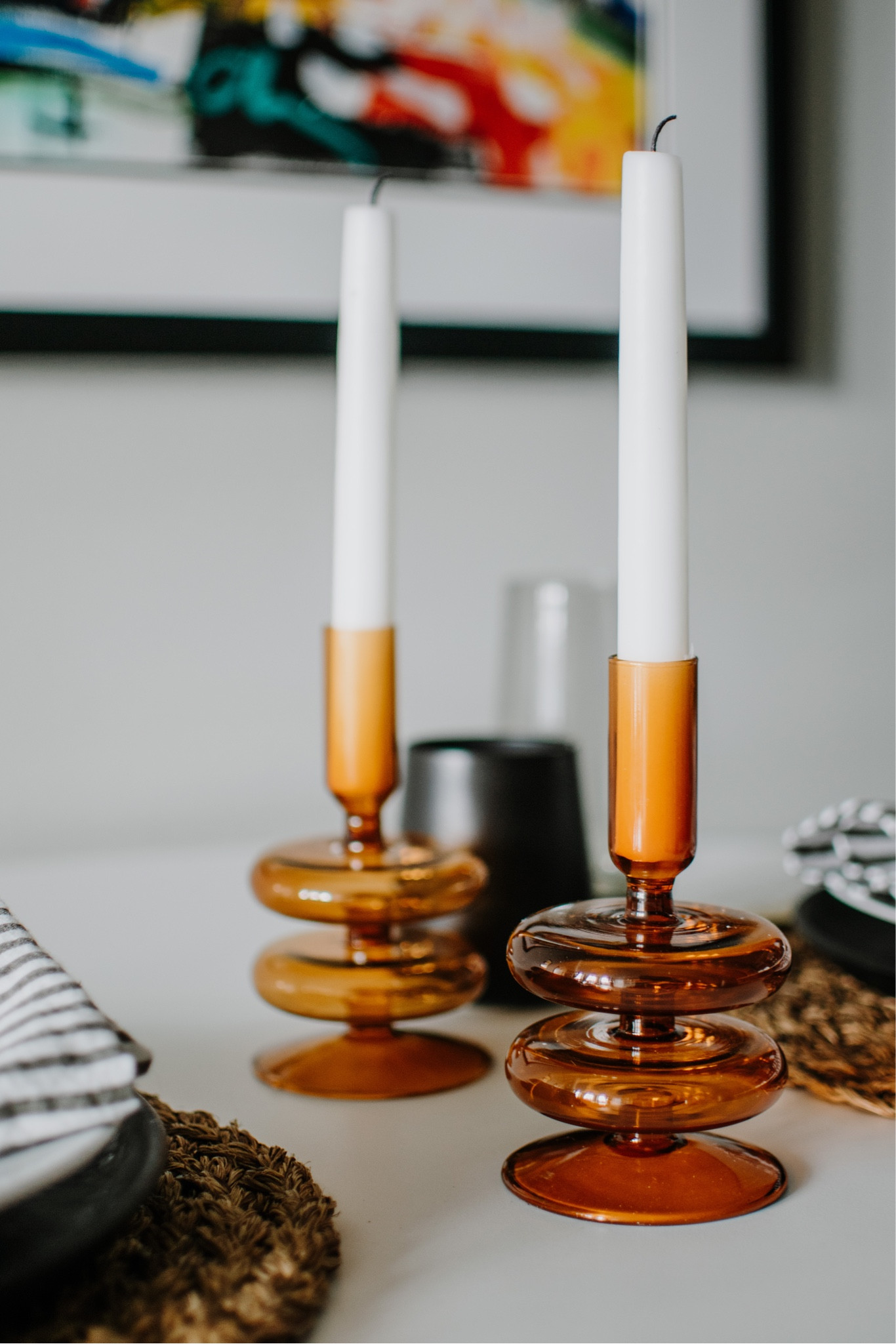 I'm working on a story for AT right now about my favorite Friday night tradition — our at home date nights, where we set the table, make fancy cocktails, and attempt recipes with a few too many steps for a weeknight. And that inspired this modern setup with a few pieces the Alice Lane team sent me (Alice happened to be my Grandma Bien's name, which I love!). 

I used Alice Lane's gorgeous stacked candlesticks (which actually match the amber drinking glasses I usually use!) and the smoke glasses. These striking shades of amber and dark gray are perfect in our dark, moody condo and play perfectly against the one bright piece in the room — this painting we got in Mexico. I kept the rest of the table simple in blacks and whites, but brought in my gold flatware to tie in the warmth of the amber. Such an easy table, but dresses up a Friday night at home.

Also, while I was setting this table up, I was listening to this week's episode of the Dear Alice podcast, which was a walk through design through the decades. It came in as a close second in my favorite series they've done, with the first being the holiday entertaining episodes late last year. Definitely give it a listen if you're a design and home enthusiast.

@alicelanehome #AliceLaneHome #AliceLanePartner #vintagestyle #vintagehome #vintagefinds #eclecticdecor #dcbloggers #dcblogger #theeverygirl #createcultivate #dccreatives #dcstyle #blogger #lifestyleblogger #entertaining #interiordesignblogger #tablescape #athomestyle #apartmenttherapy #creativebusinessowners #creativeprofessional #creativelifehappylife #interiordesigner #interiordesign #interiordecorating #interiordesigndc #interiorsnapshot #edesign #lonnyliving #edesigner


#LTKSeasonal #LTKhome #LTKunder50