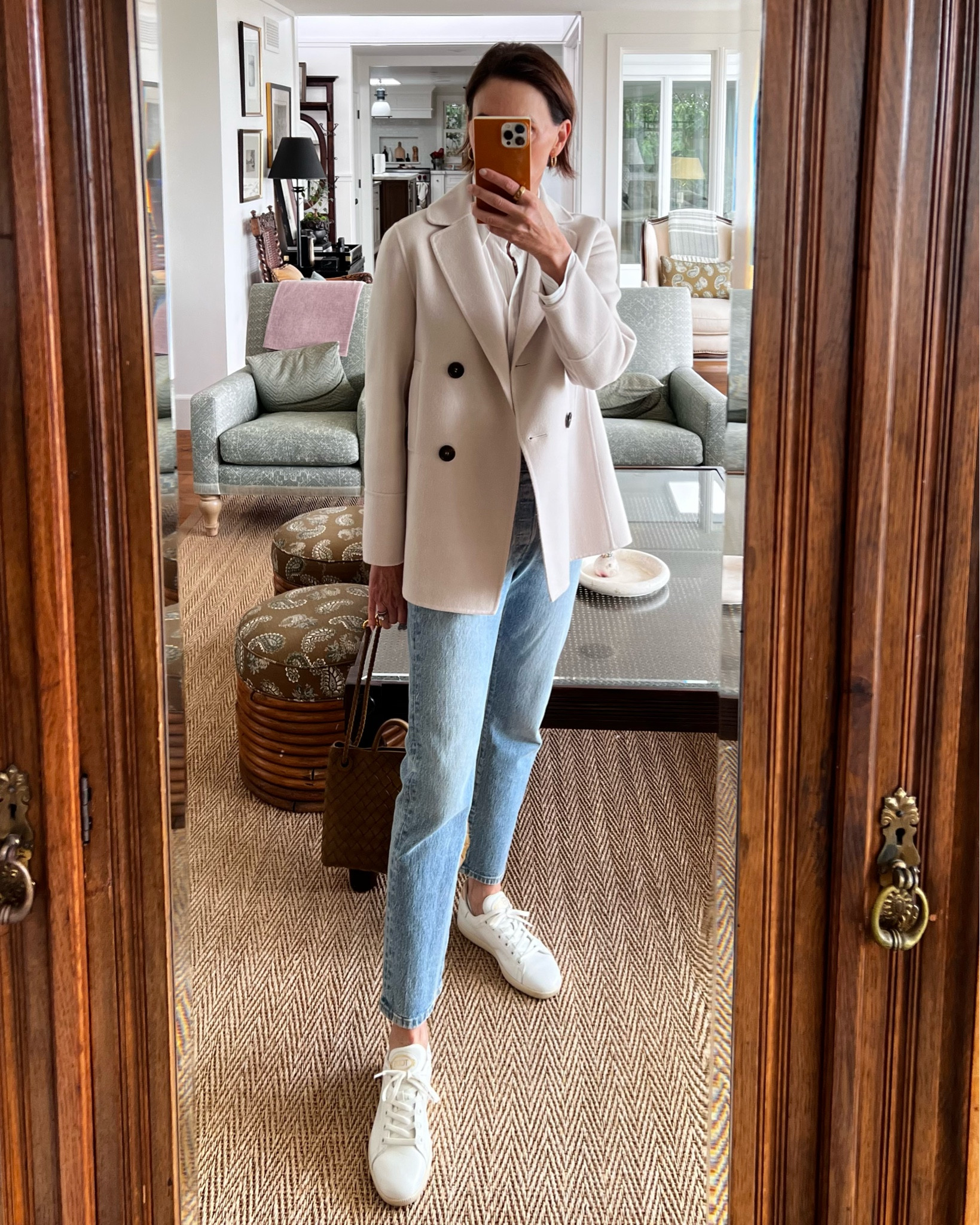 Quick lunch with a friend in this casual look. This time of year, the mornings are cool while the afternoons heat up - meaning layers are in order.⁠
⁠
Wearing Levi's with a striped shirt and an old S'Max Mara cashmere jacket from 4 or 5 years ago. It's a classic and I also have it in black.⁠
⁠
Tod's sneakers, Bottega bag...oldies but goodies. The Bottega Andiamo bag is still readily available in numerous sizes and colors. I love this funky color (Acorn if I remember correctly) that looks so much more interesting with everything it's paired with. Adding one piece that's slightly off is a styling bit I use often.⁠

Links to similar products below.

#LTKStyleTip #LTKSeasonal