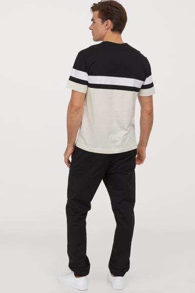 Relaxed-fit joggers in stretch cotton twill with a lightly brushed finish. Elasticized drawstring... | H&M (US + CA)