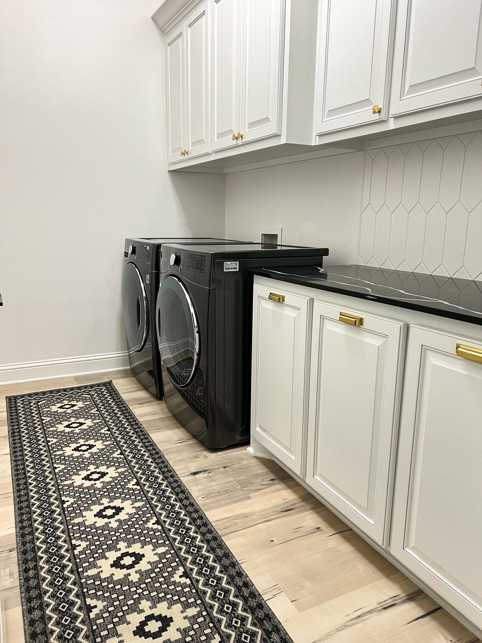 Love this indoor/outdoor safavieh runner rug for my laundry room! 

Black and white runner, Amazon, affordable. 

#LTKunder50 #LTKFind #LTKhome